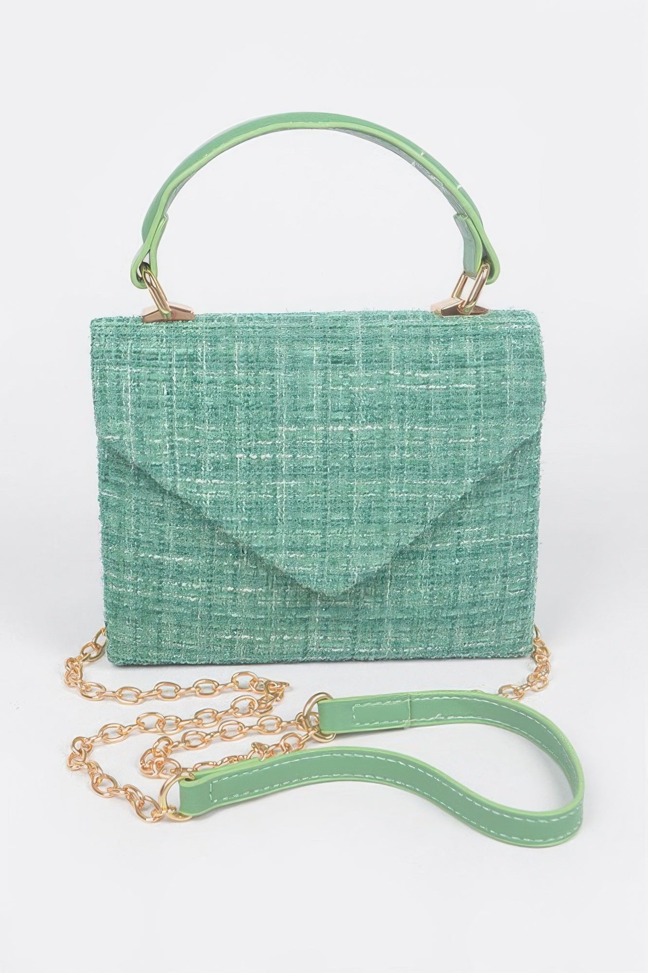 Tweed top handle bag in green with short handle, gold chain strap, and flap closure