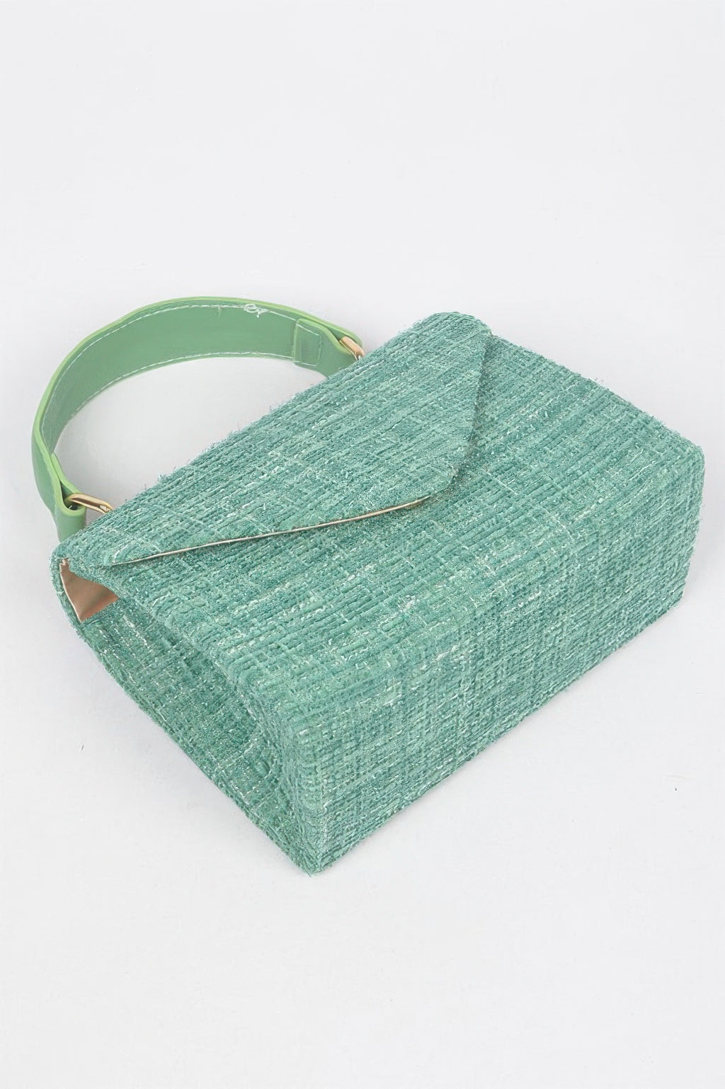 Green tweed top handle bag, showing back edge and thin gold chain strap detail