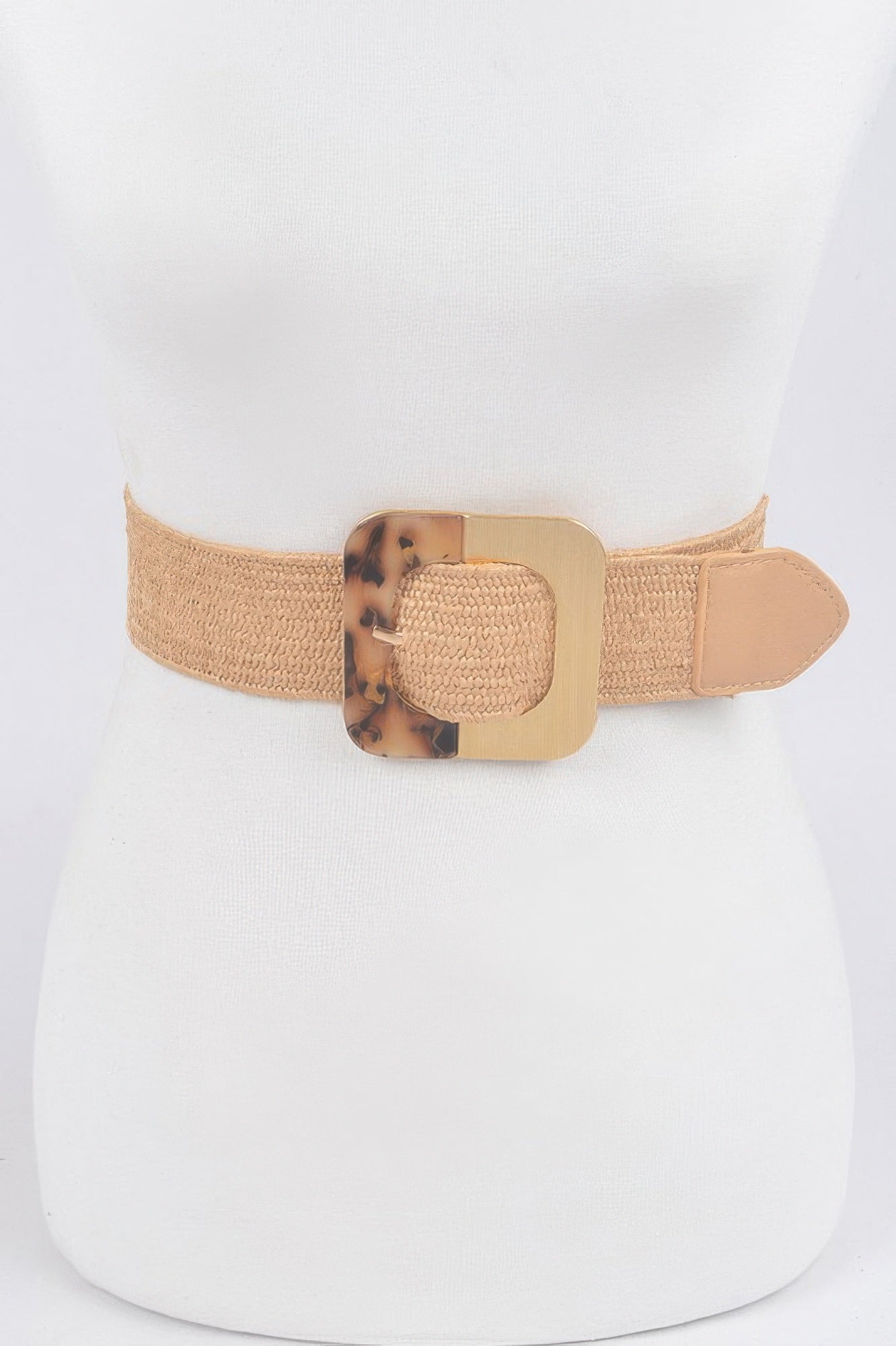 Square metal buckle on brown stretch belt with tan end tab