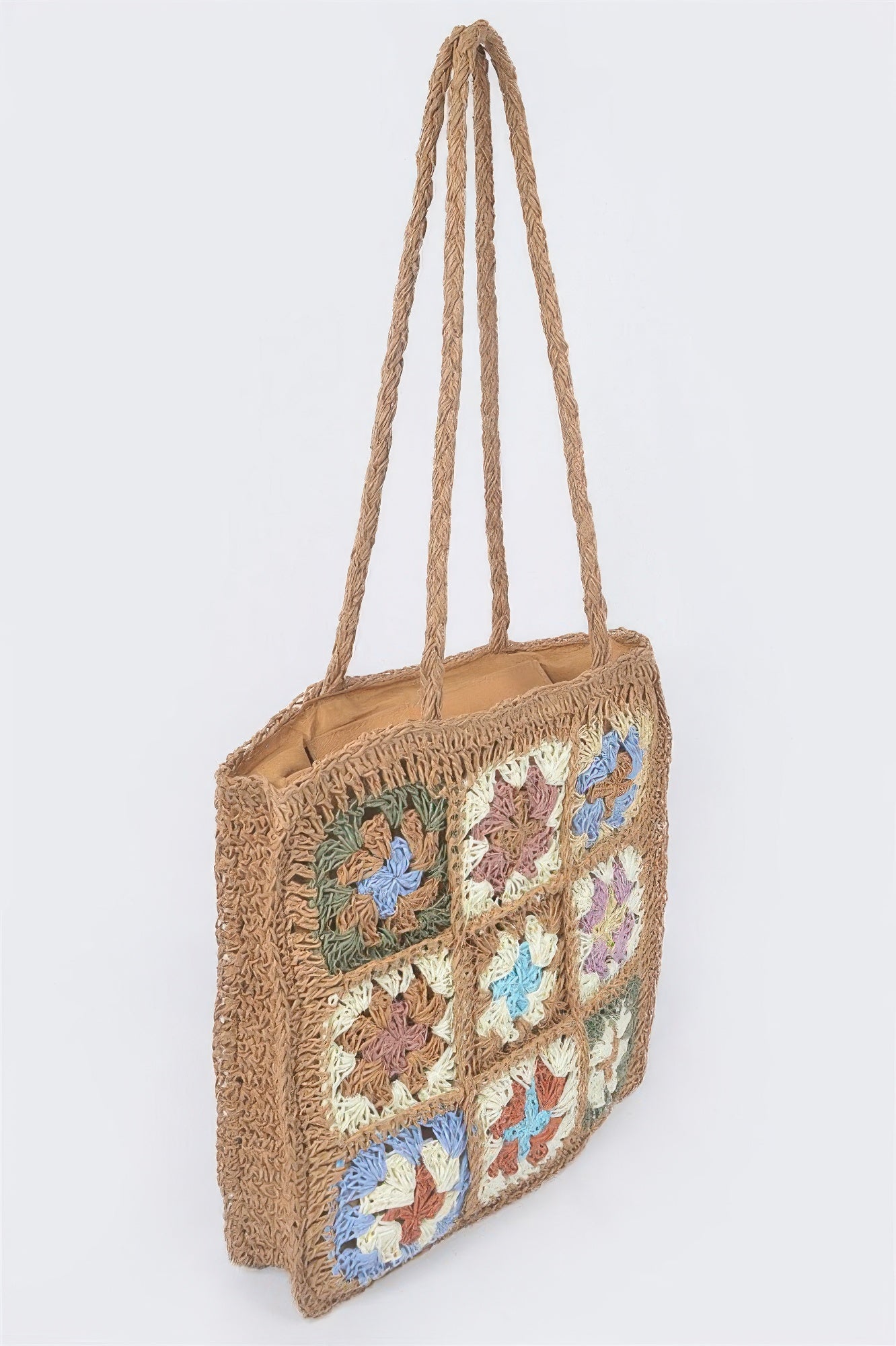 Khaki faux straw tote bag with crocheted floral squares and rope handles