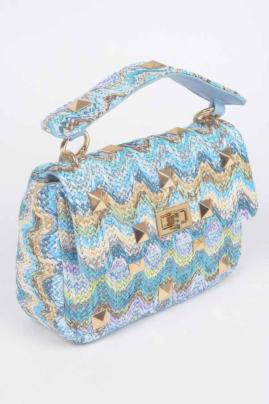 Blue chevron faux straw flap bag with gold stud accents, top handle, and short strap