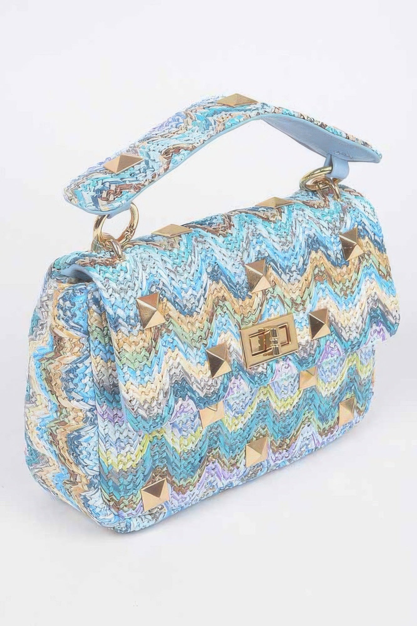 Blue chevron faux straw flap bag with gold stud accents, top handle, and short strap