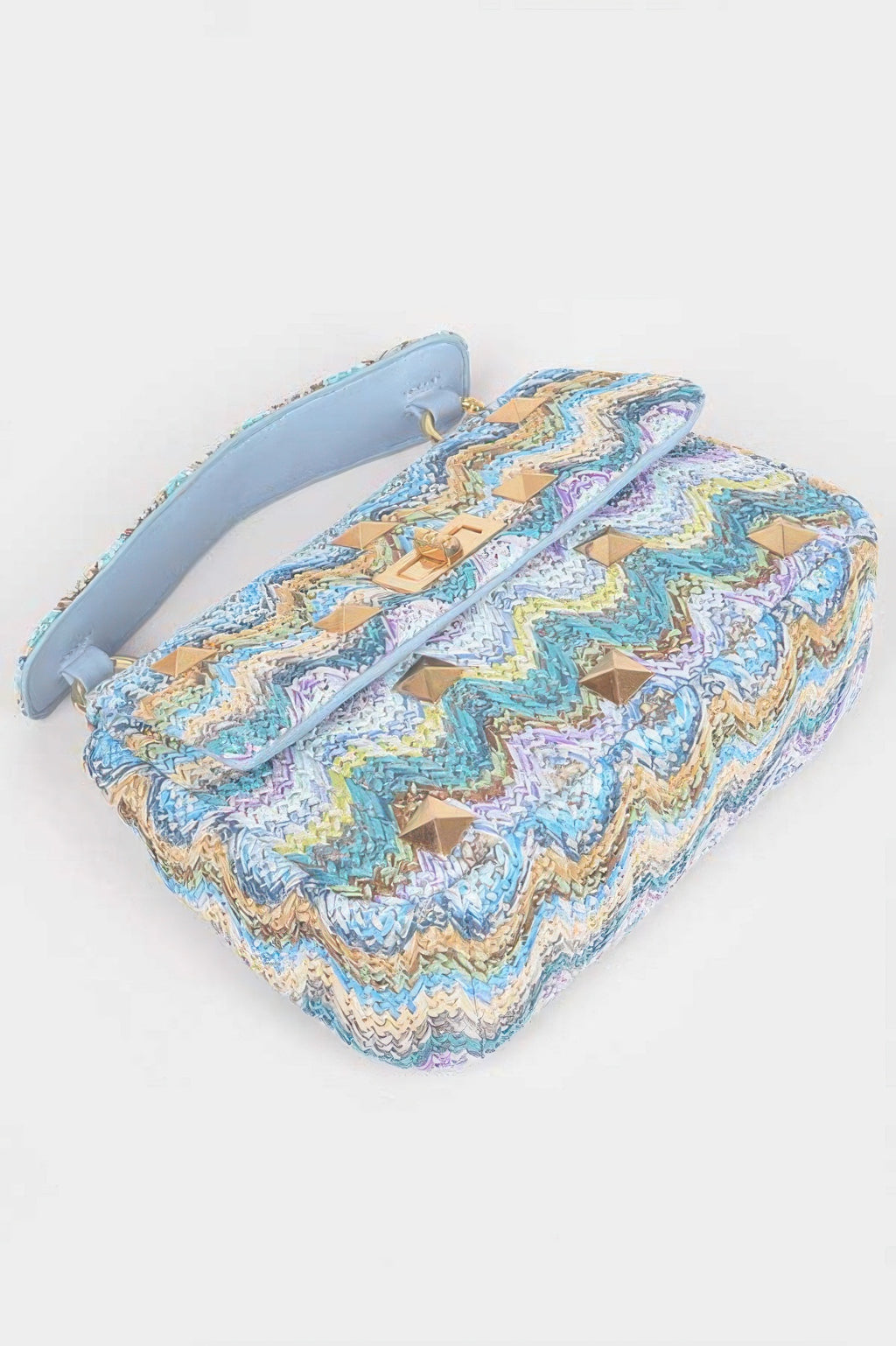 Faux straw flap top-handle bag, blue chevron pattern with gold studs and light-blue strap