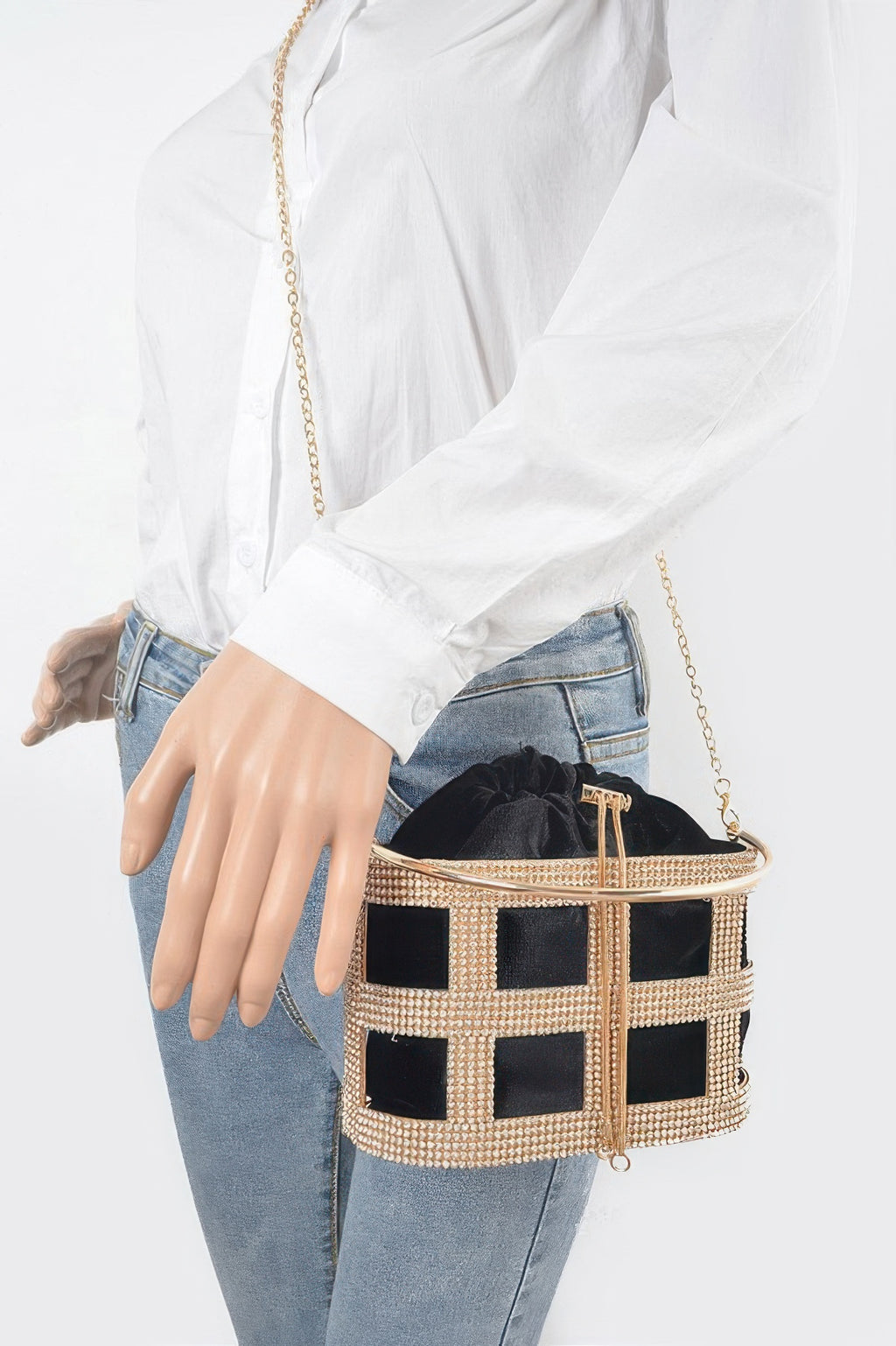 Black rhinestone frame clutch worn crossbody with gold metal chain strap