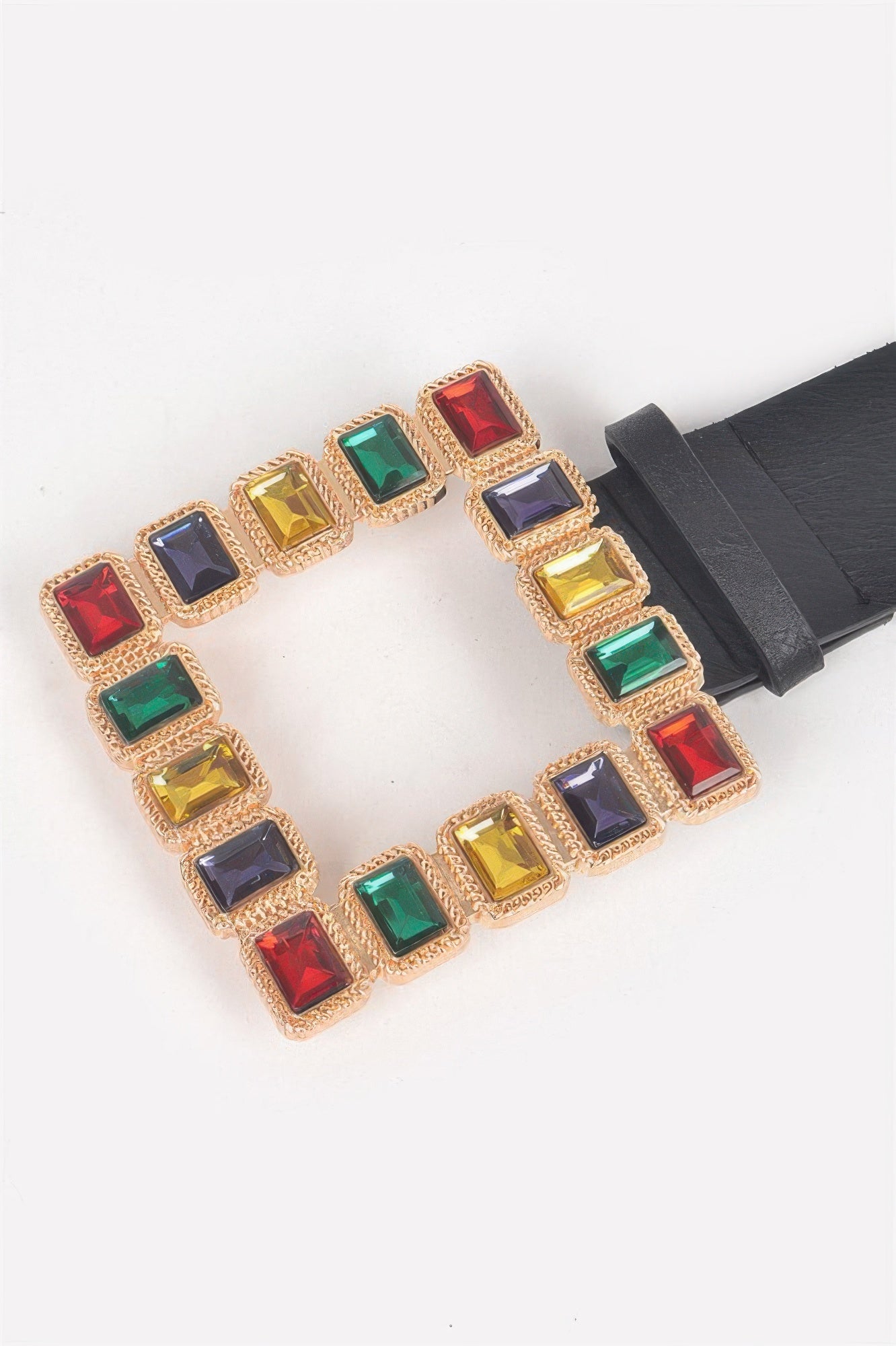 Close-up: multicolored rhinestone square pendant on black belt strap