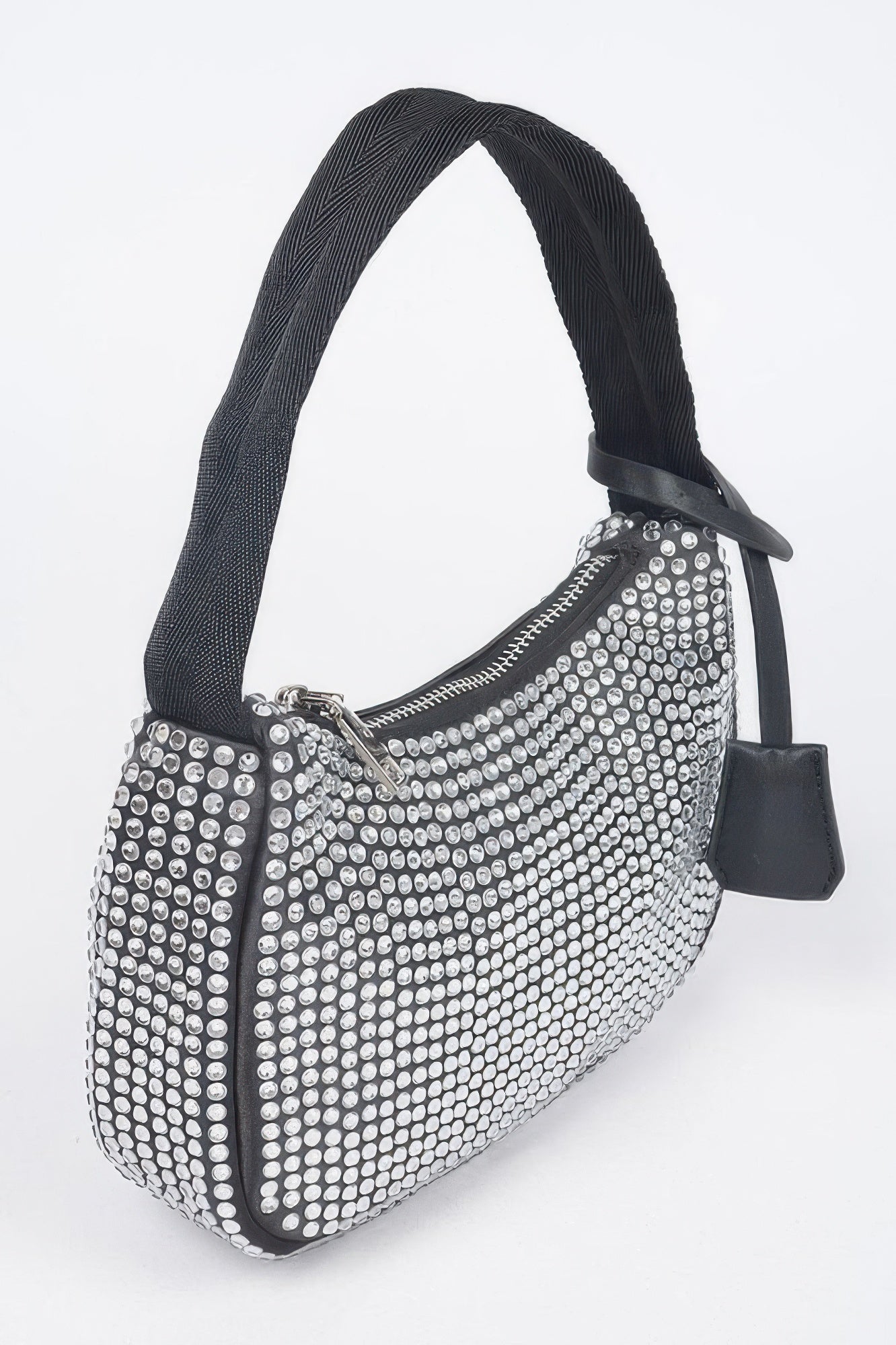 Black rhinestone shoulder bag, side view with zipper, front charm tag, and strap