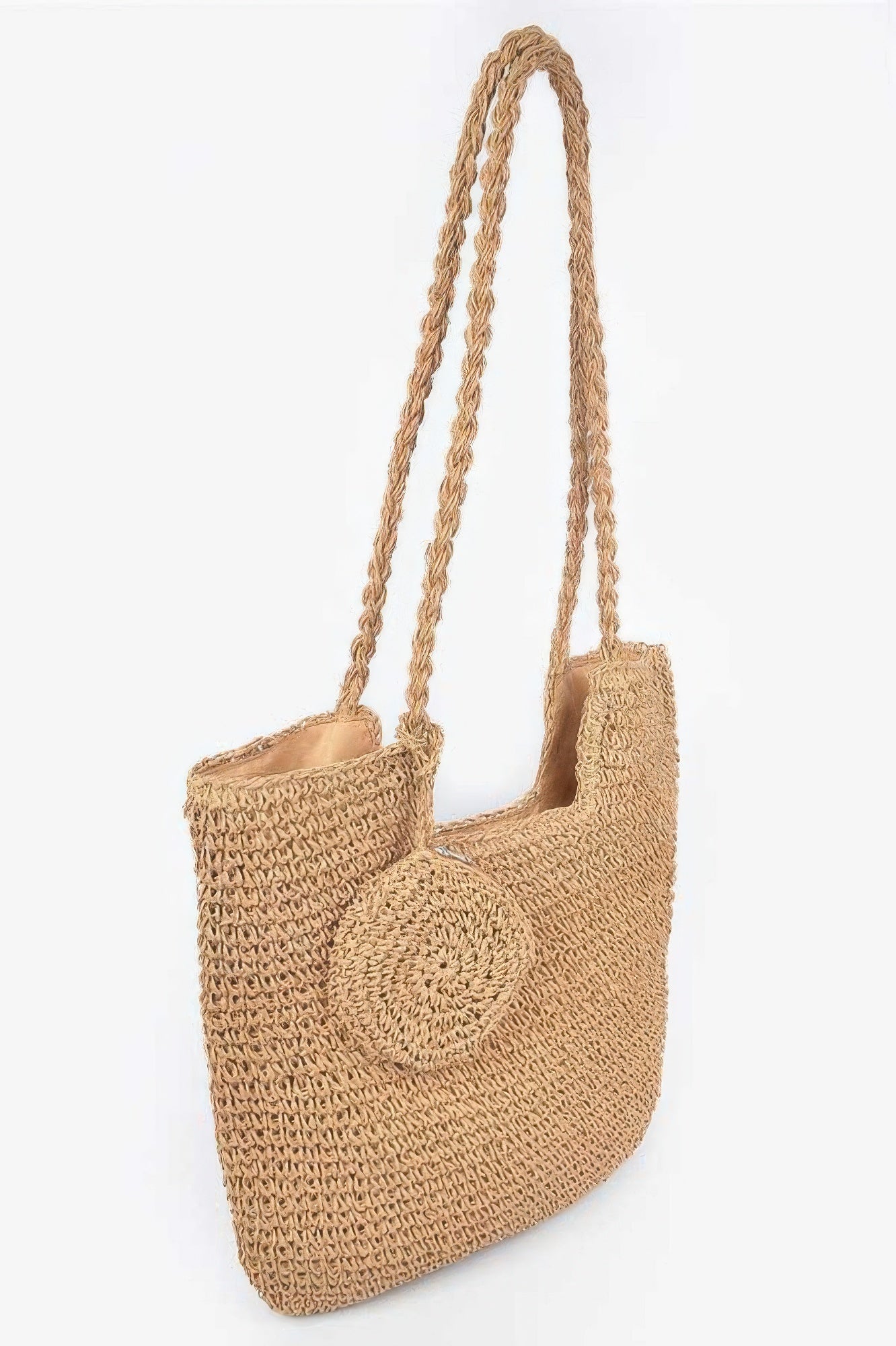 Faux straw tote bag side angle with rope handles and rounded front detail