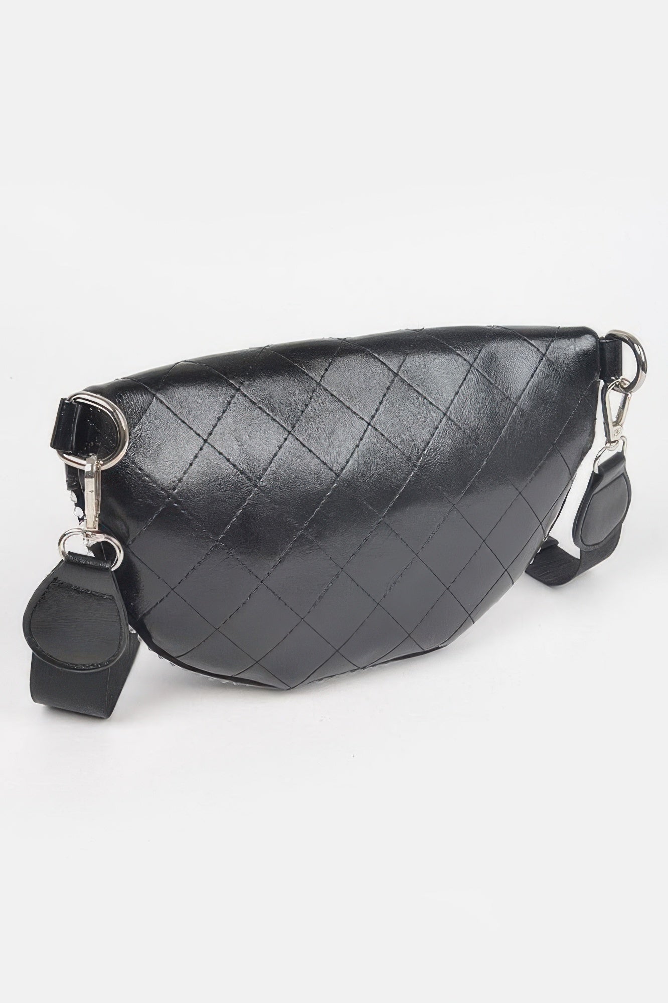 Black quilted fanny pack with silver-tone hardware and curved front, no stones visible