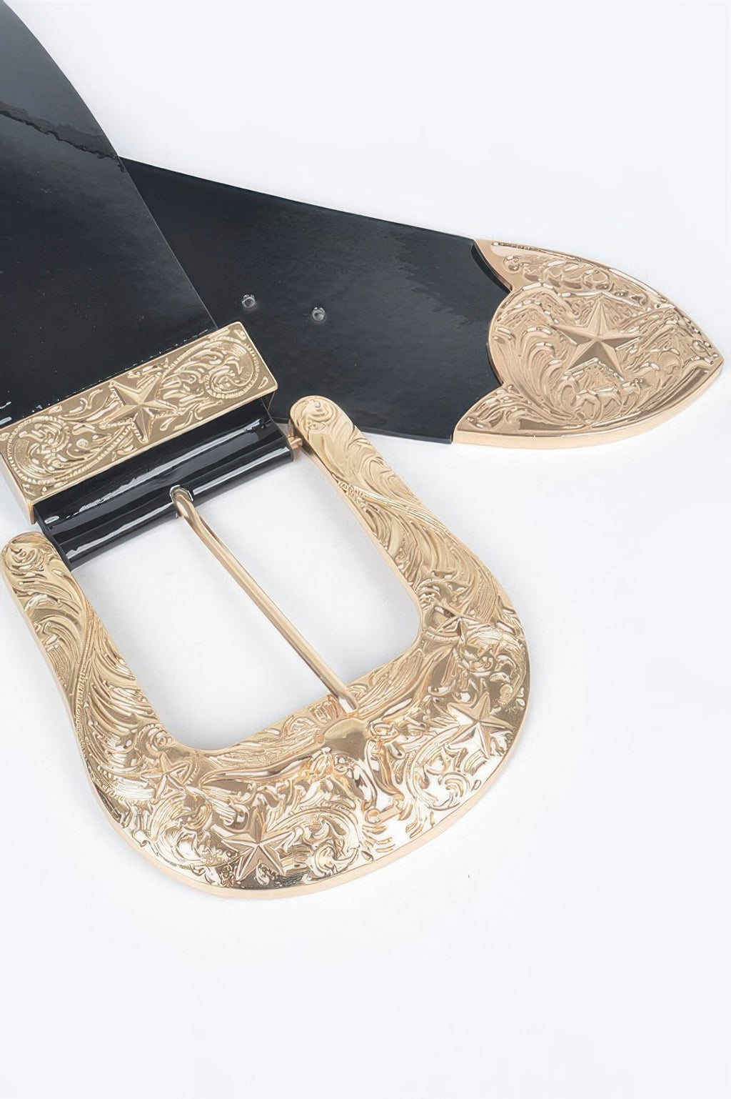 Oversized enamel belt close-up: gold ornate buckle with black strap and rectangular centerpiece