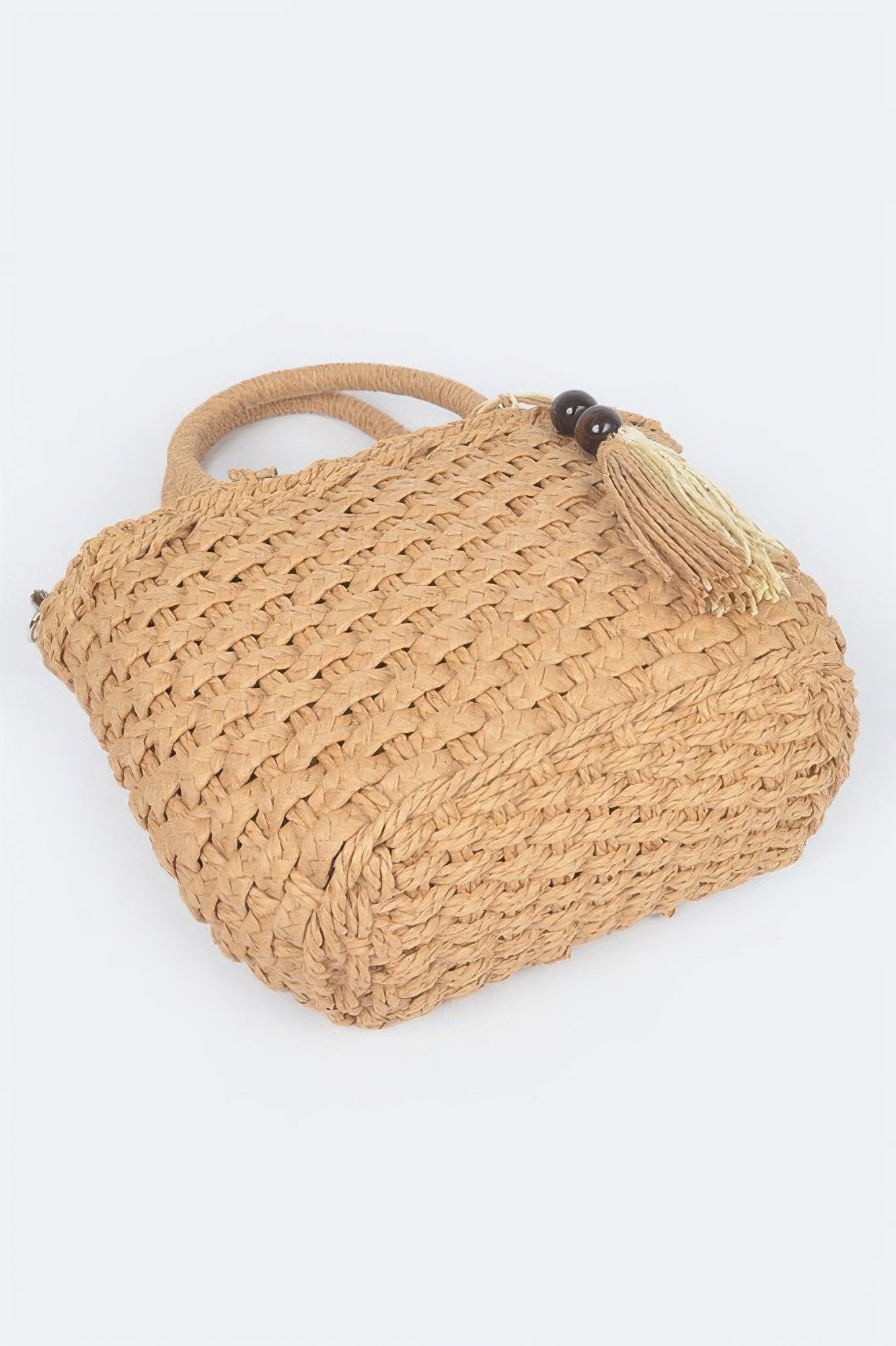 Faux straw tote bag in khaki color, rounded top, woven pattern and tassel with bead accent
