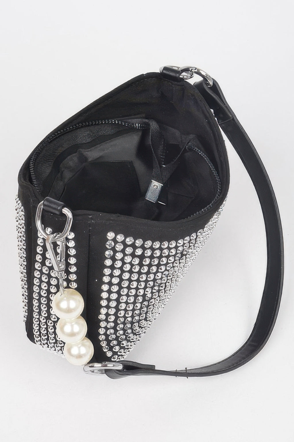 Black micro suede crossbody bag interior with open top, ring hardware, and pearl charm