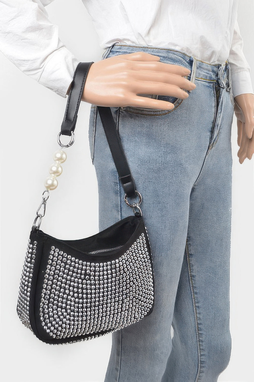 Black rhinestone crossbody bag with chain strap and pearl drop accessory