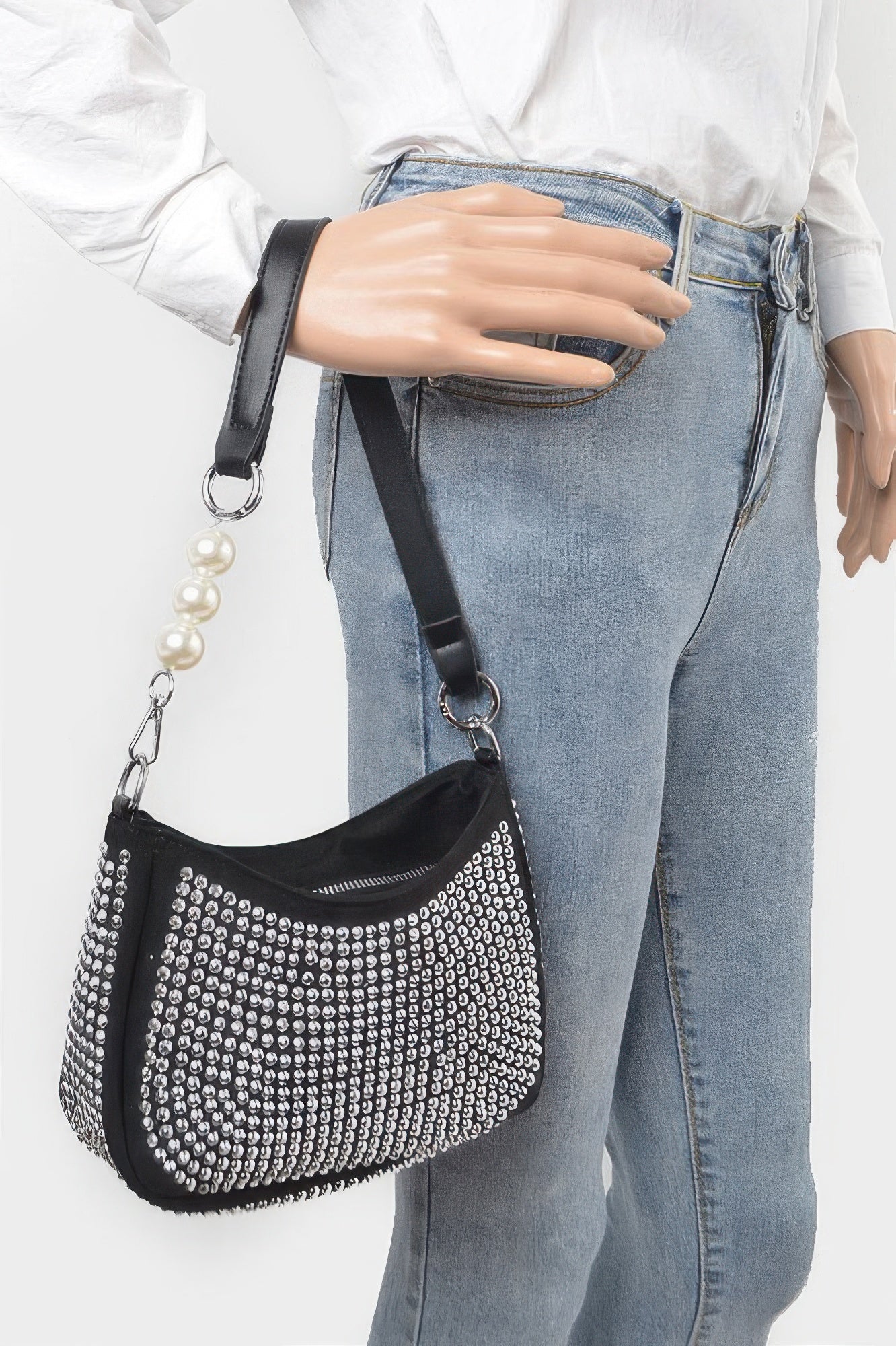 Black rhinestone crossbody bag with chain strap and pearl drop accessory