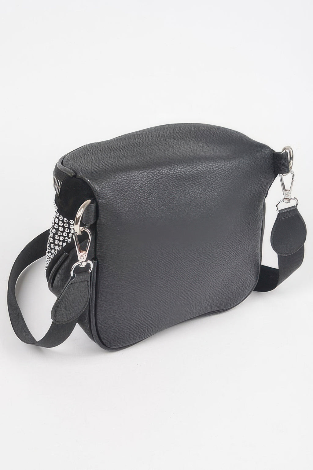 Side view of stone-studded crossbody bag, textured black body with silver dots
