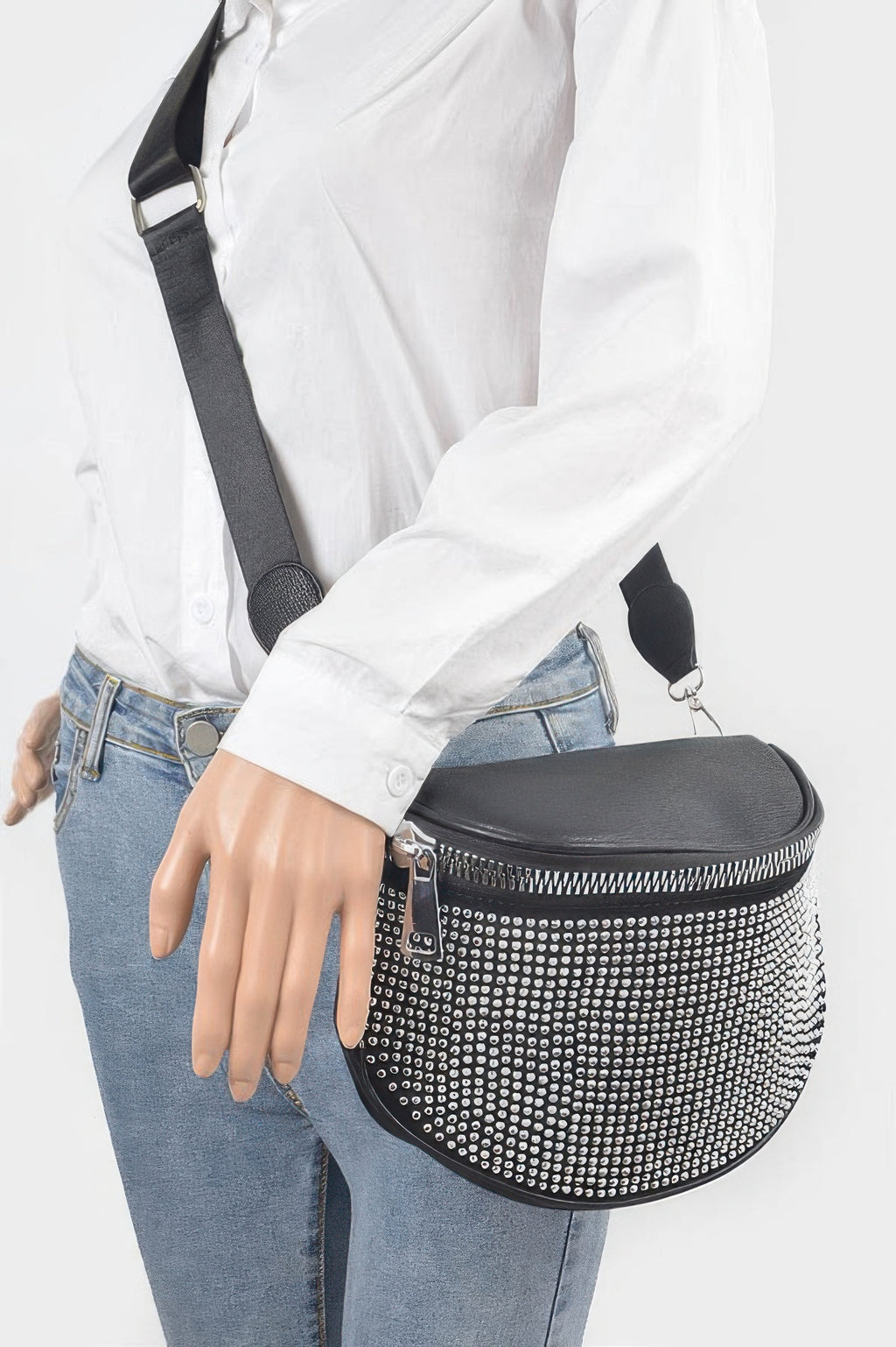 Stone-studded crossbody on model, black half-moon bag with silver dot front