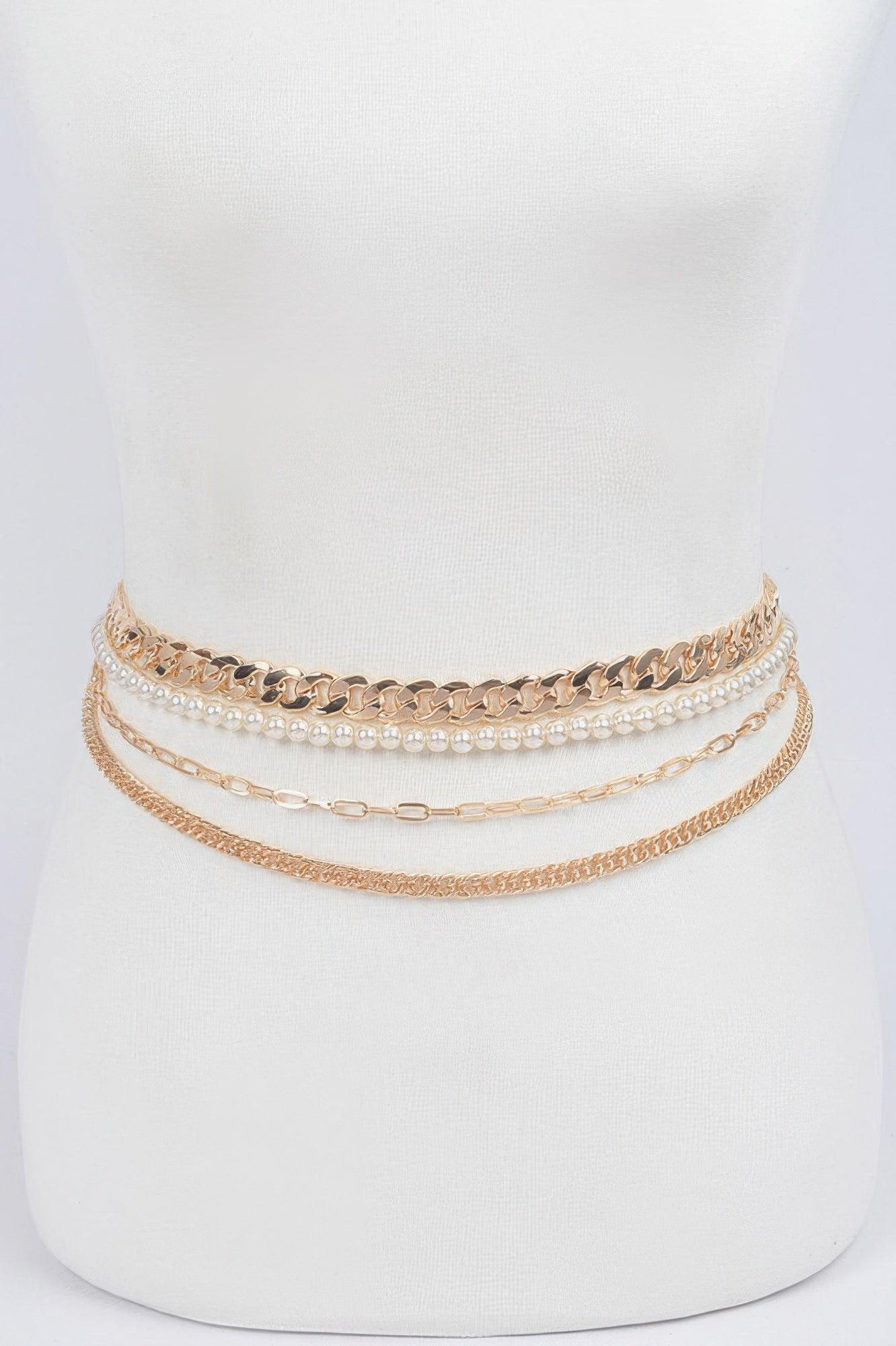 Multi Layer Chain Belt in gold tones with pearl-accented links on a draped band