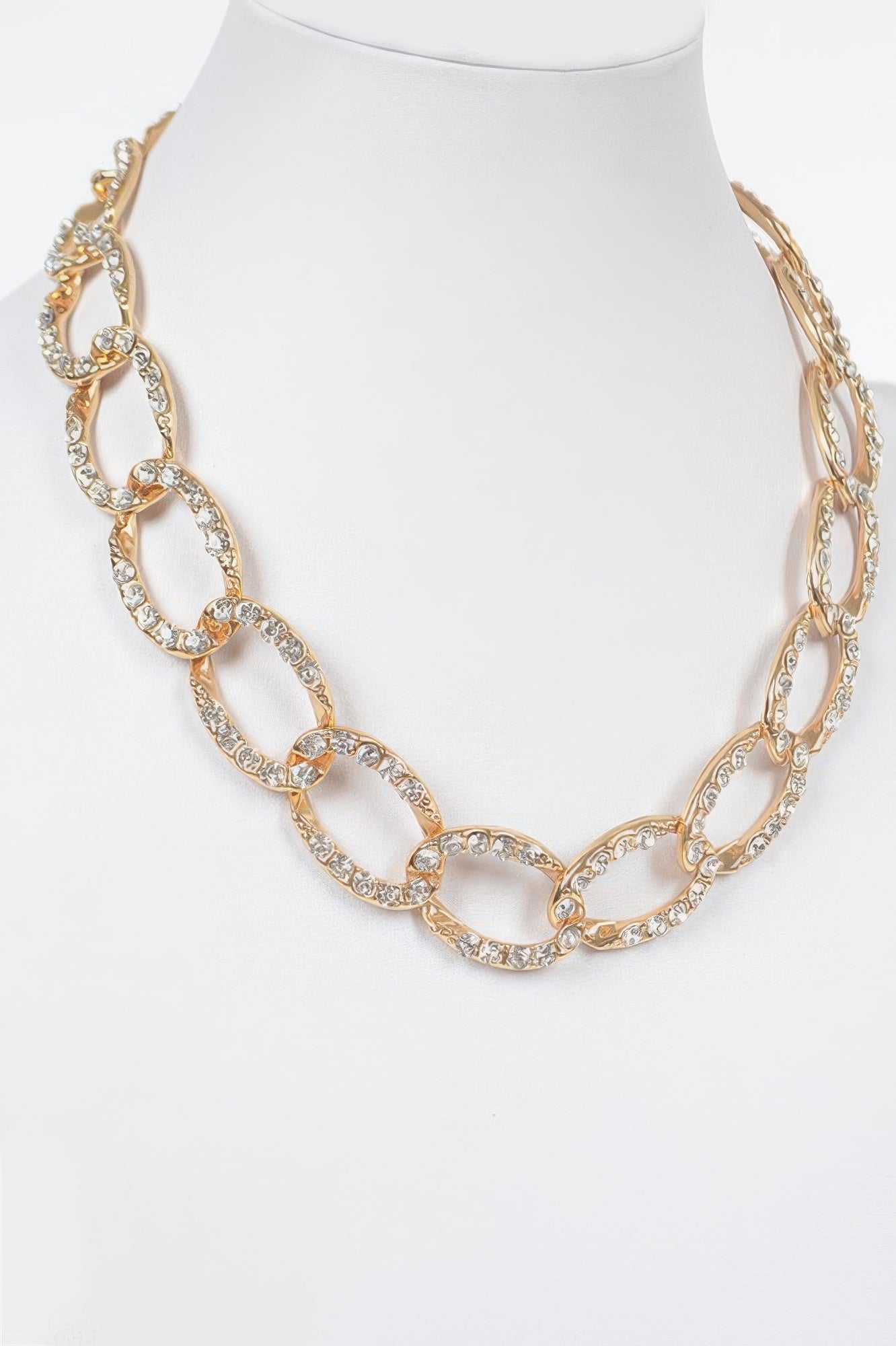 Gold-tone oval link chain necklace with rhinestone-style stones