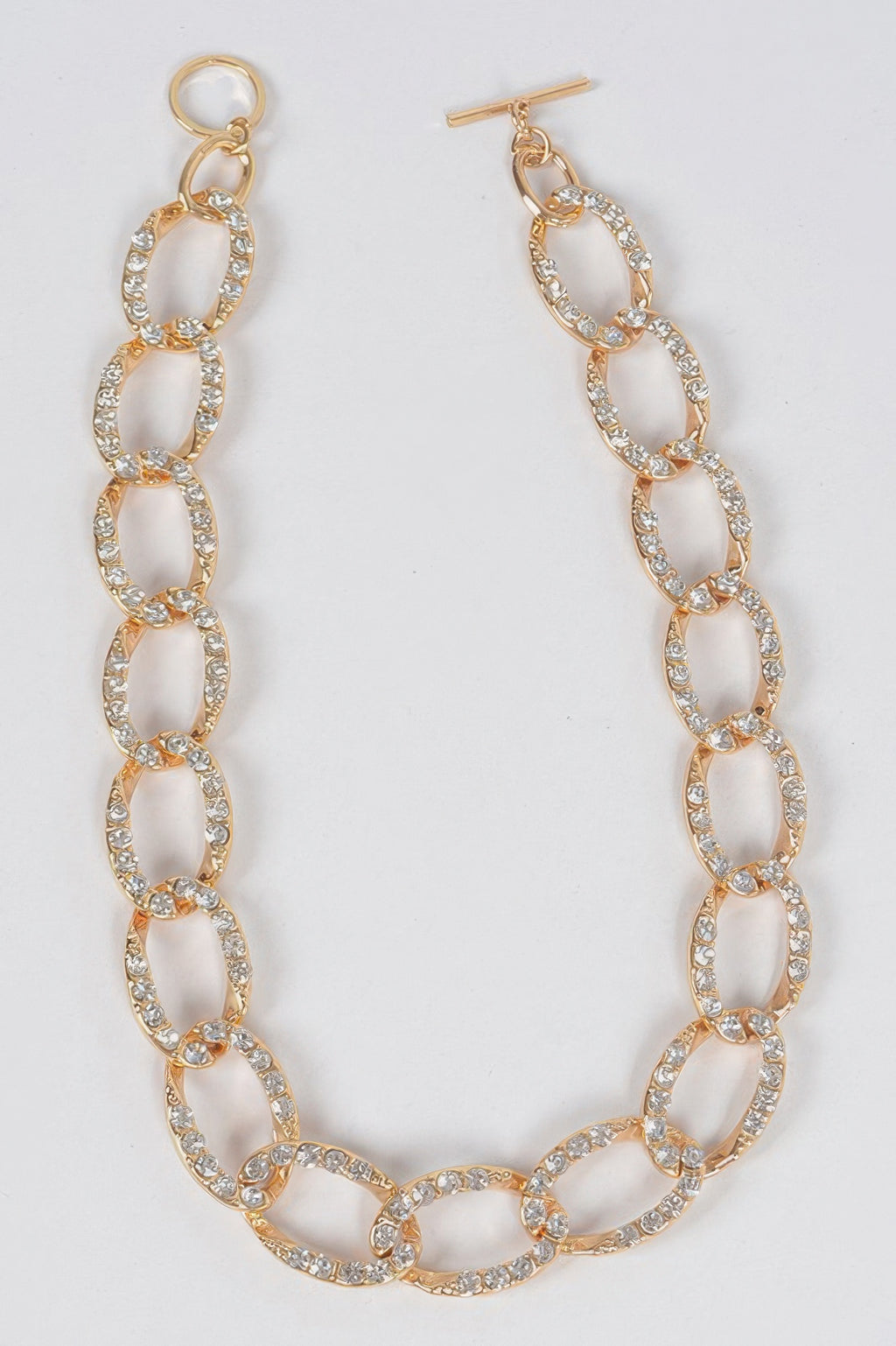 Gold-tone oval link stone necklace with small sparkle pavé stones