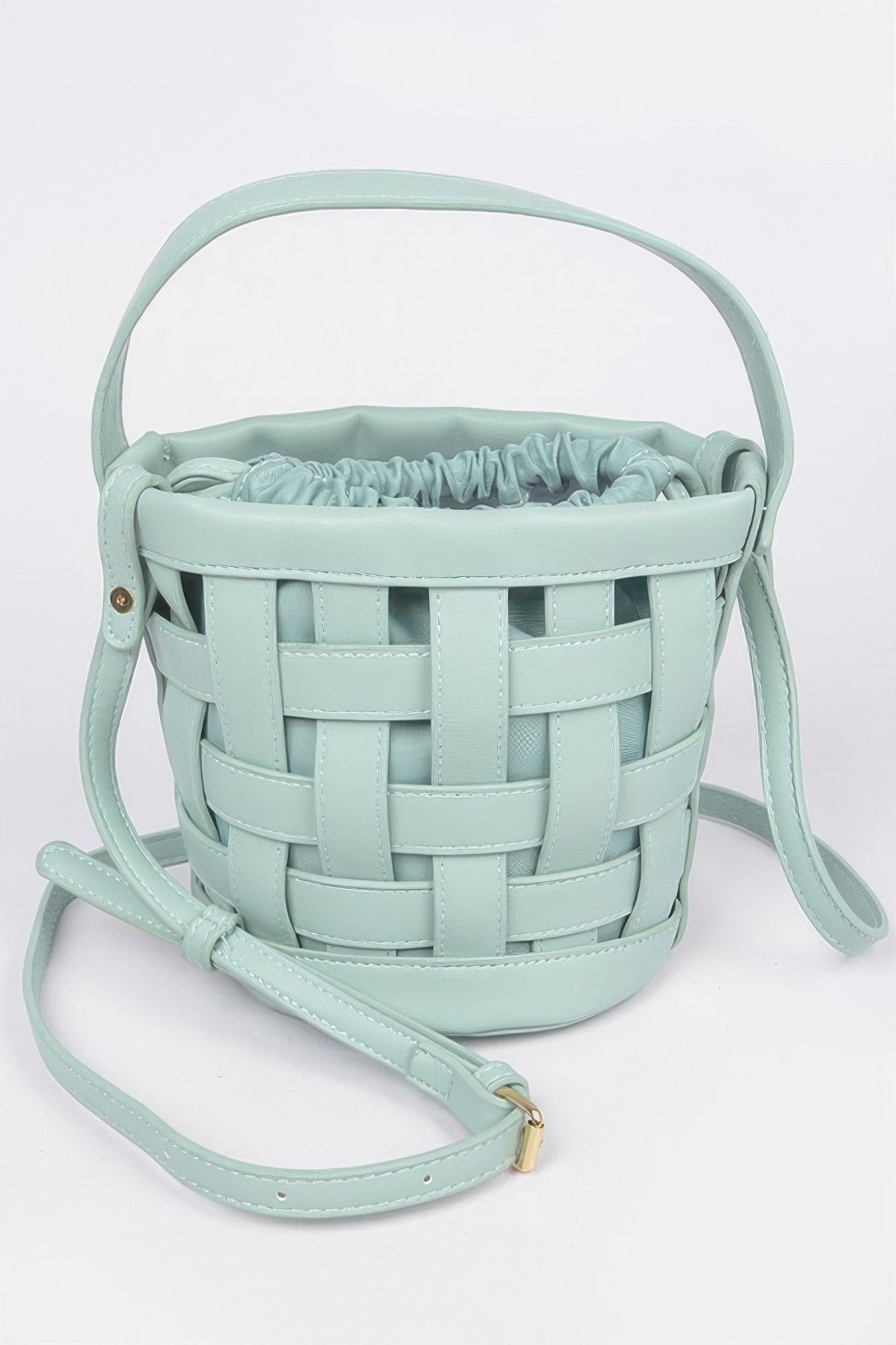 Mint leather crossbody clutch with woven basket front and adjustable strap
