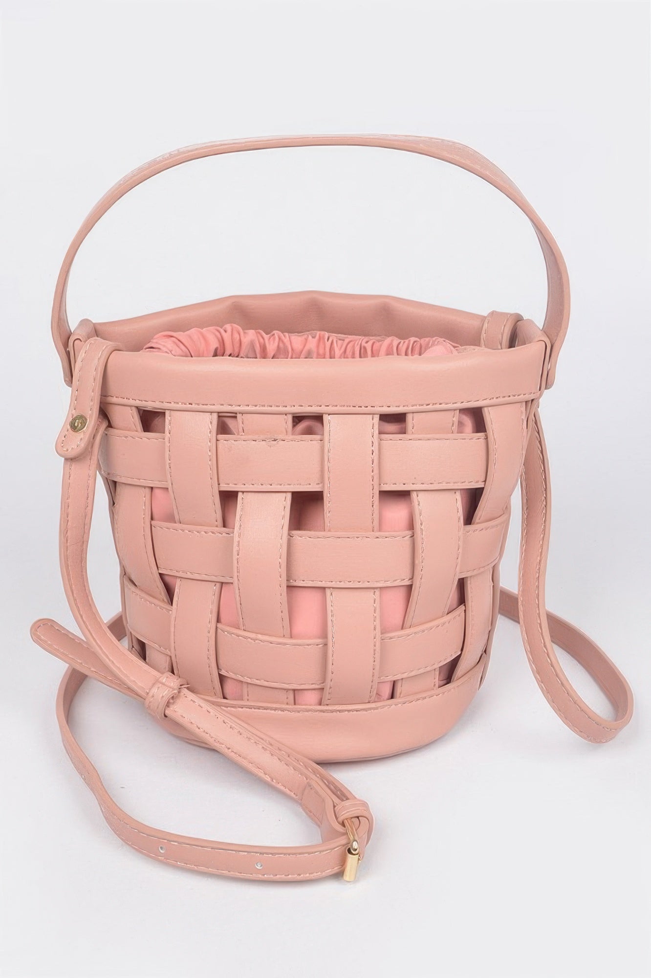 Pink leather crossbody clutch with woven basket front and long shoulder strap