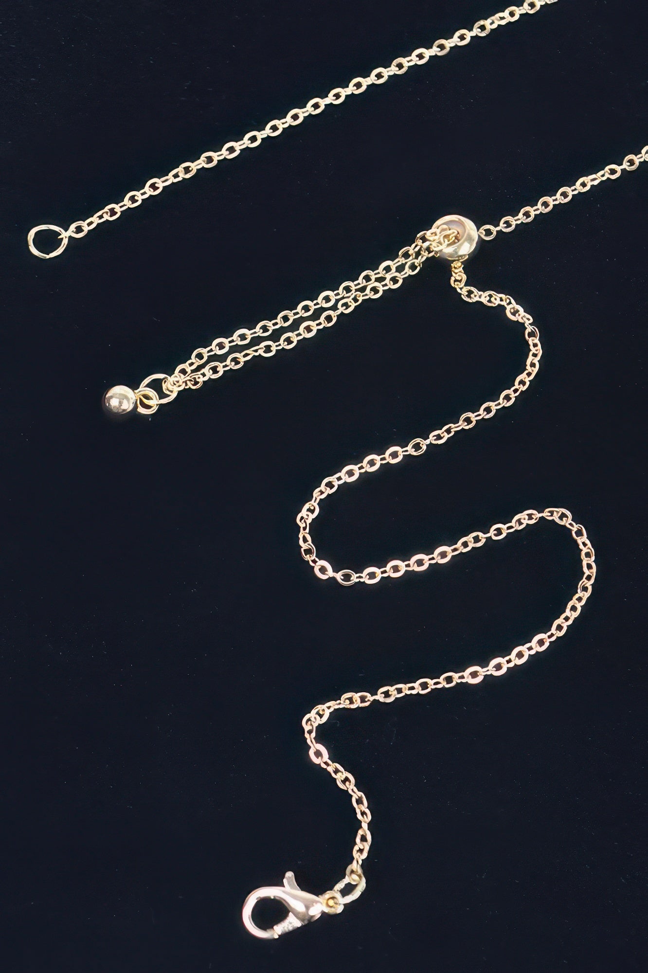 Gold-tone rhinestone choker chain with lobster clasp and heart charm