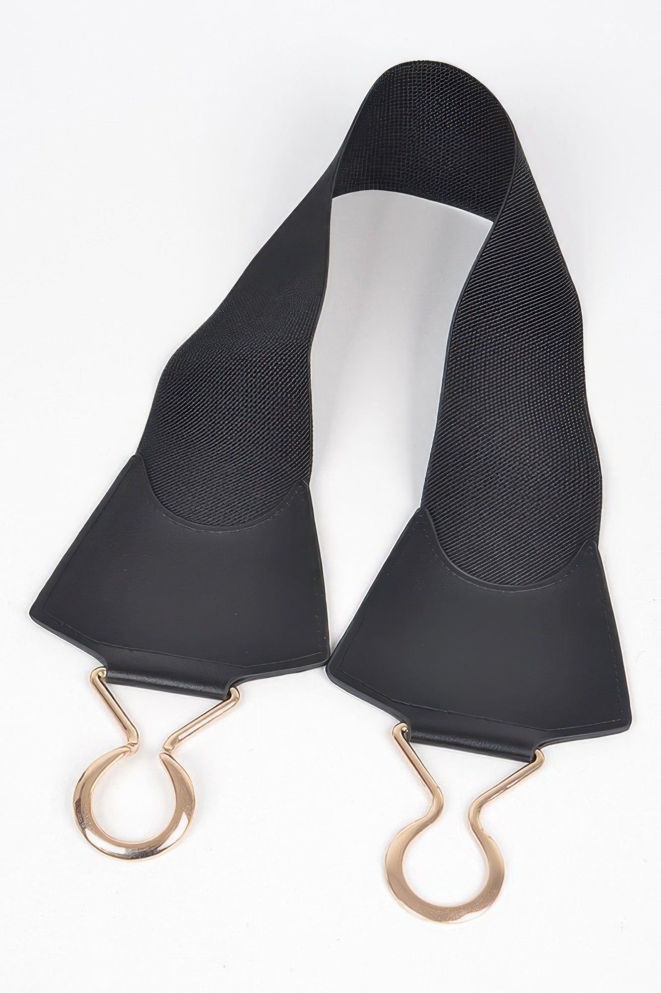 Black faux leather wide elastic belt—underside view with gold-tone D-ring details