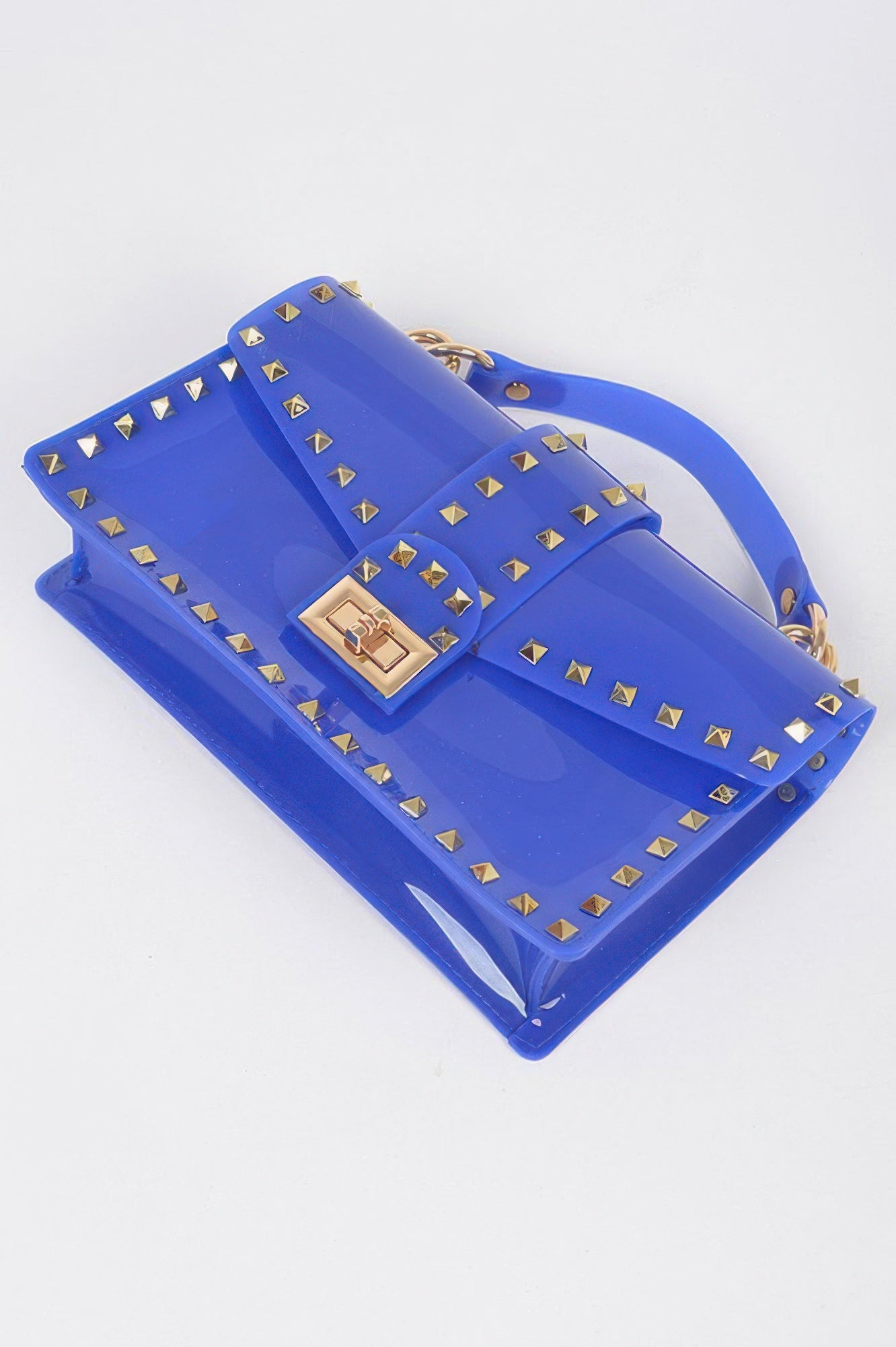 Cobalt transparent clutch bag with gold studs, front flap and chain strap