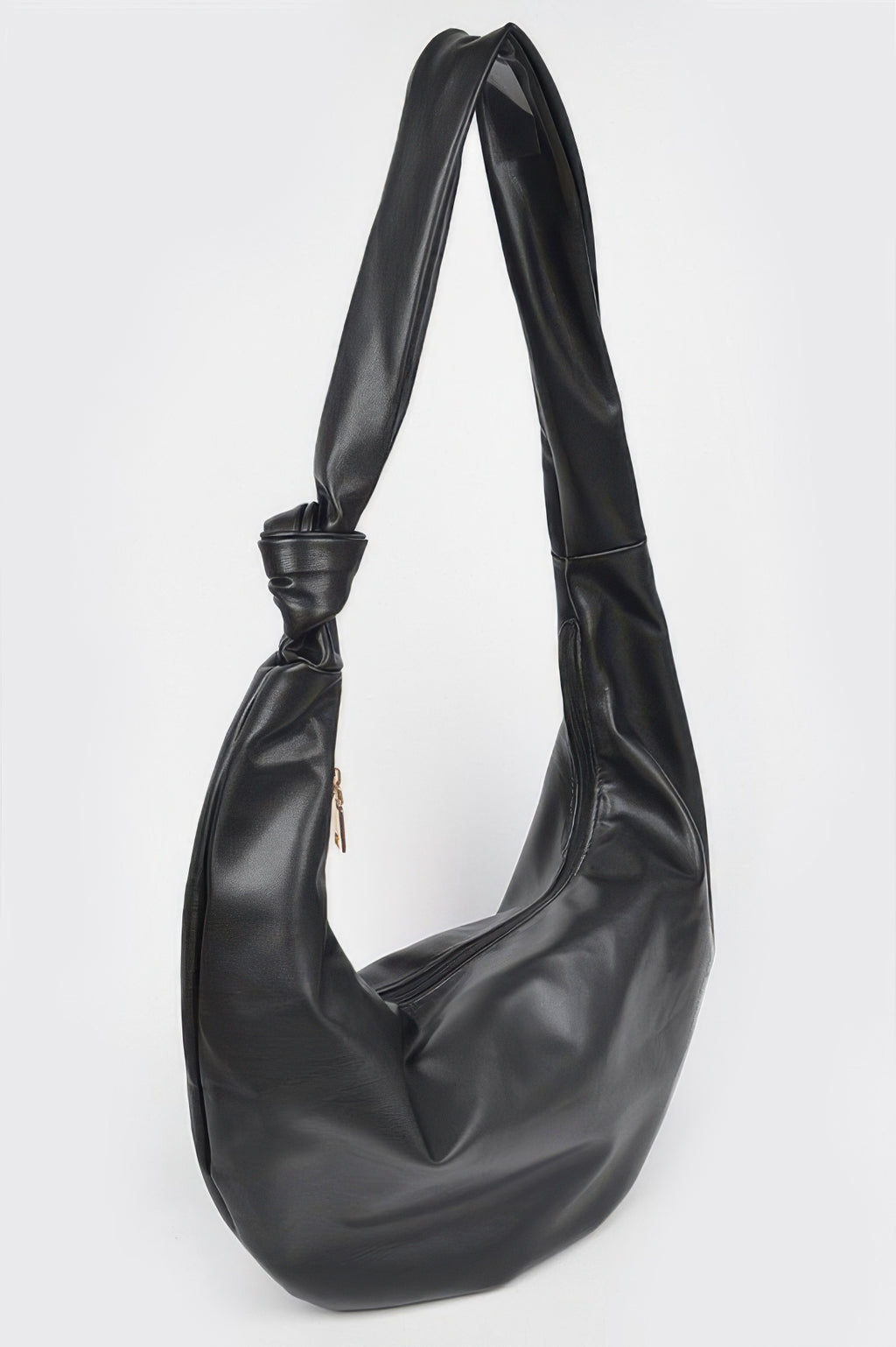 Black faux leather hobo bag with side seam detail, long handles and crescent silhouette