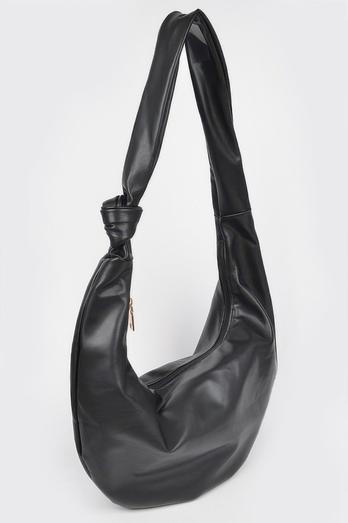 Black faux leather hobo bag with side seam detail, long handles and crescent silhouette