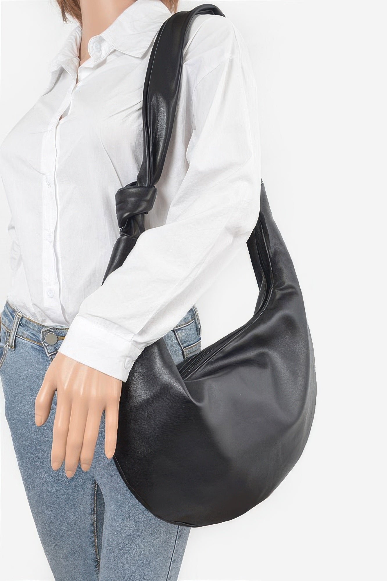 Black faux leather hobo bag with soft drape, wide open crescent opening