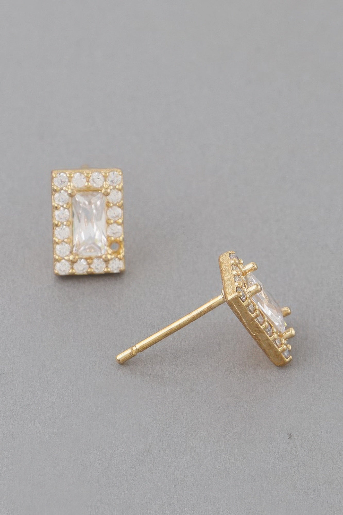 Gold clear square rhinestone stud earring, front view with faceted center