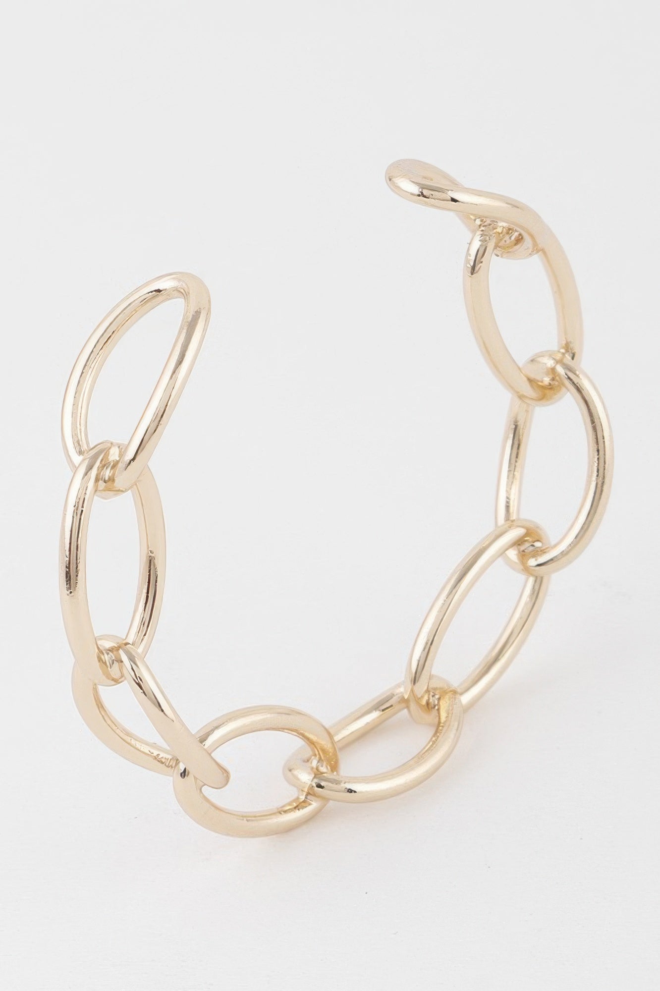 Gold link chain cuff bracelet with interlocking oval links