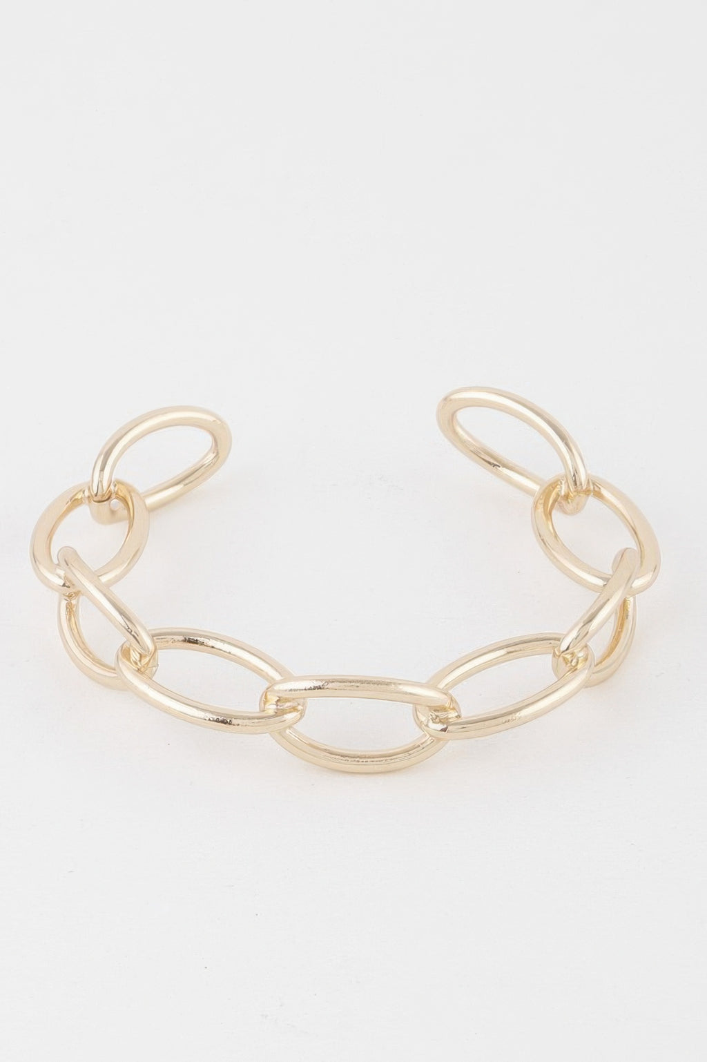 Gold chain cuff bracelet with wide oval links and open cuff shape