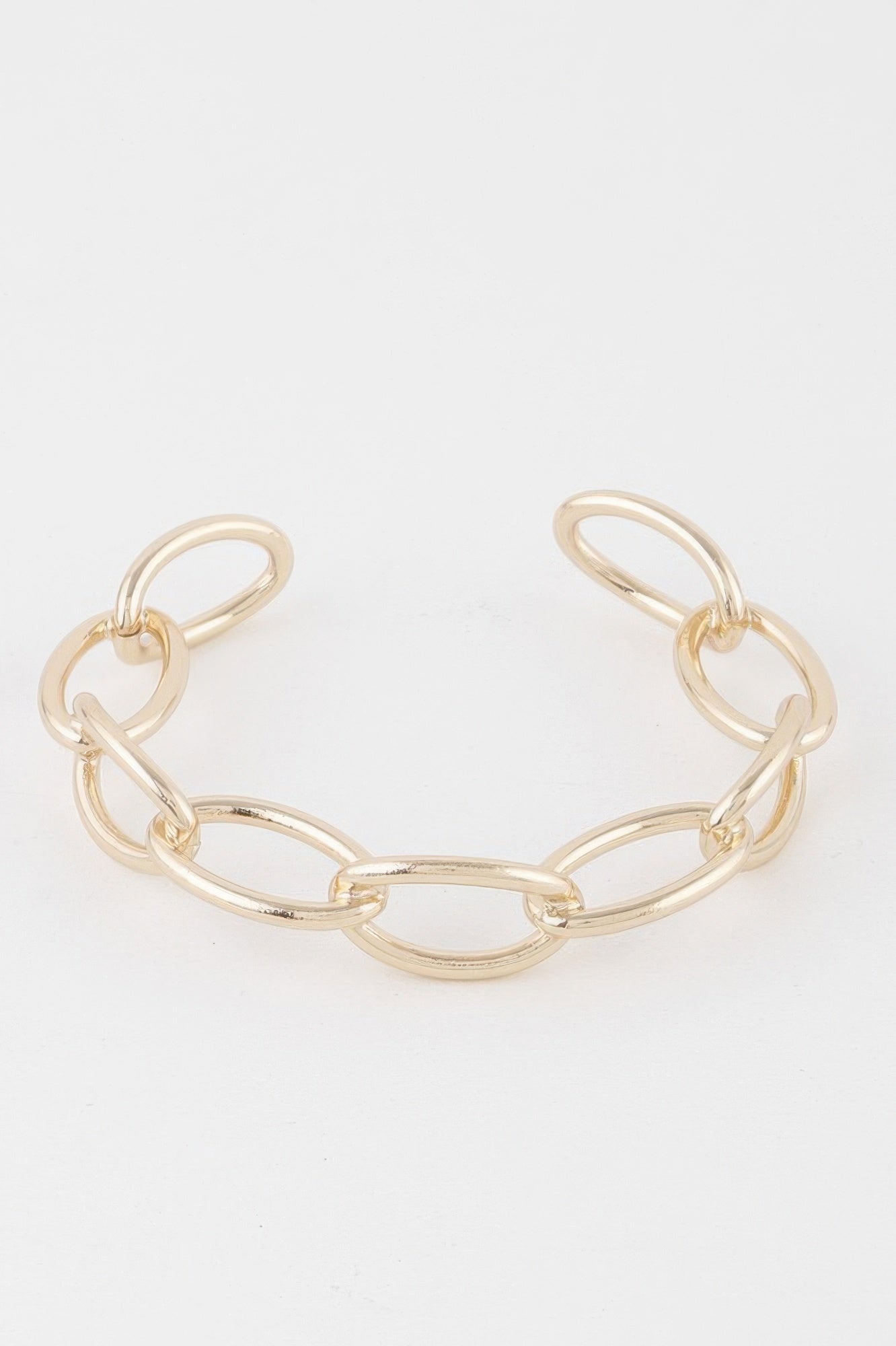 Gold chain cuff bracelet with wide oval links and open cuff shape