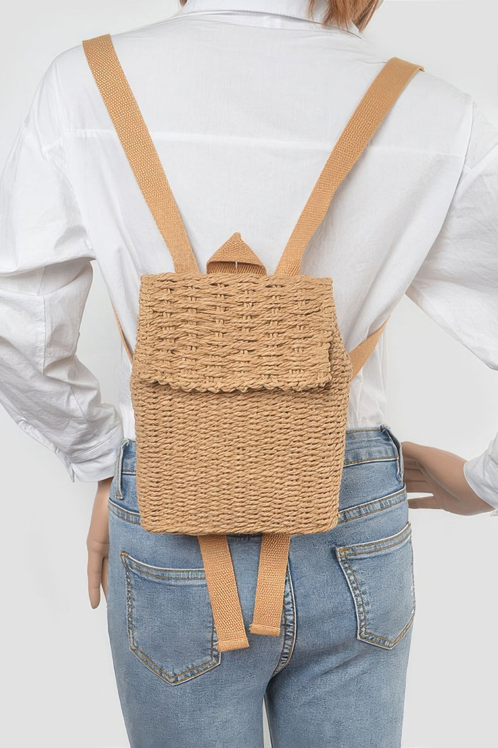 Woven cotton mini backpack worn on back with two shoulder straps