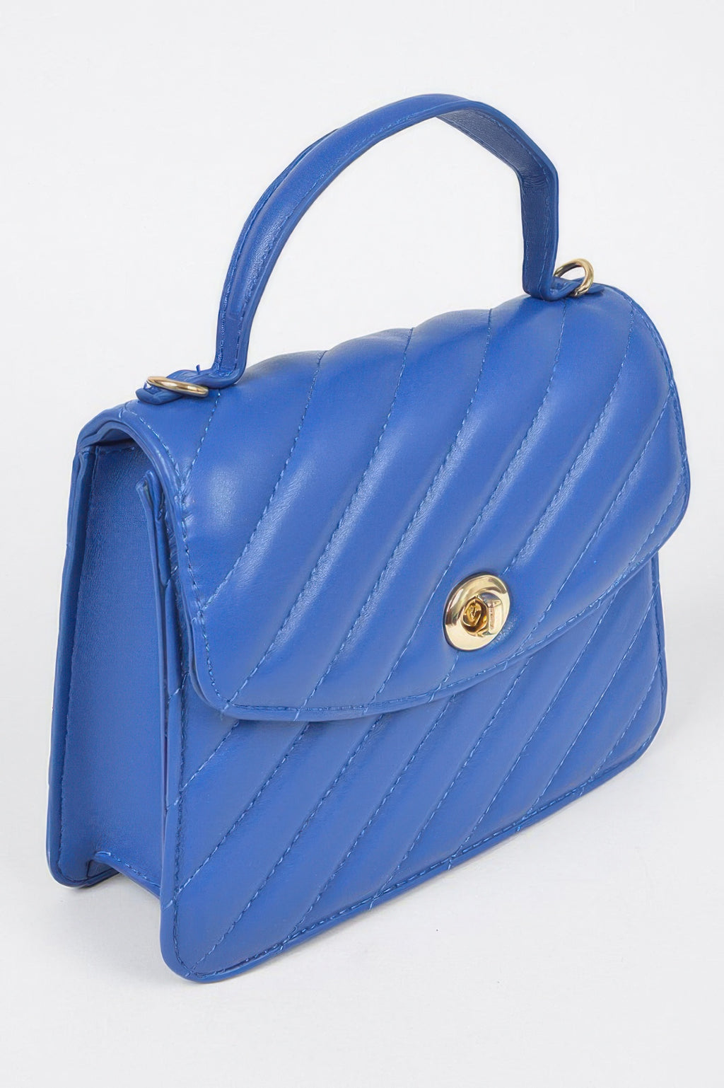 Quilted cobalt blue flap bag with top handle, gold clasp and shoulder chain