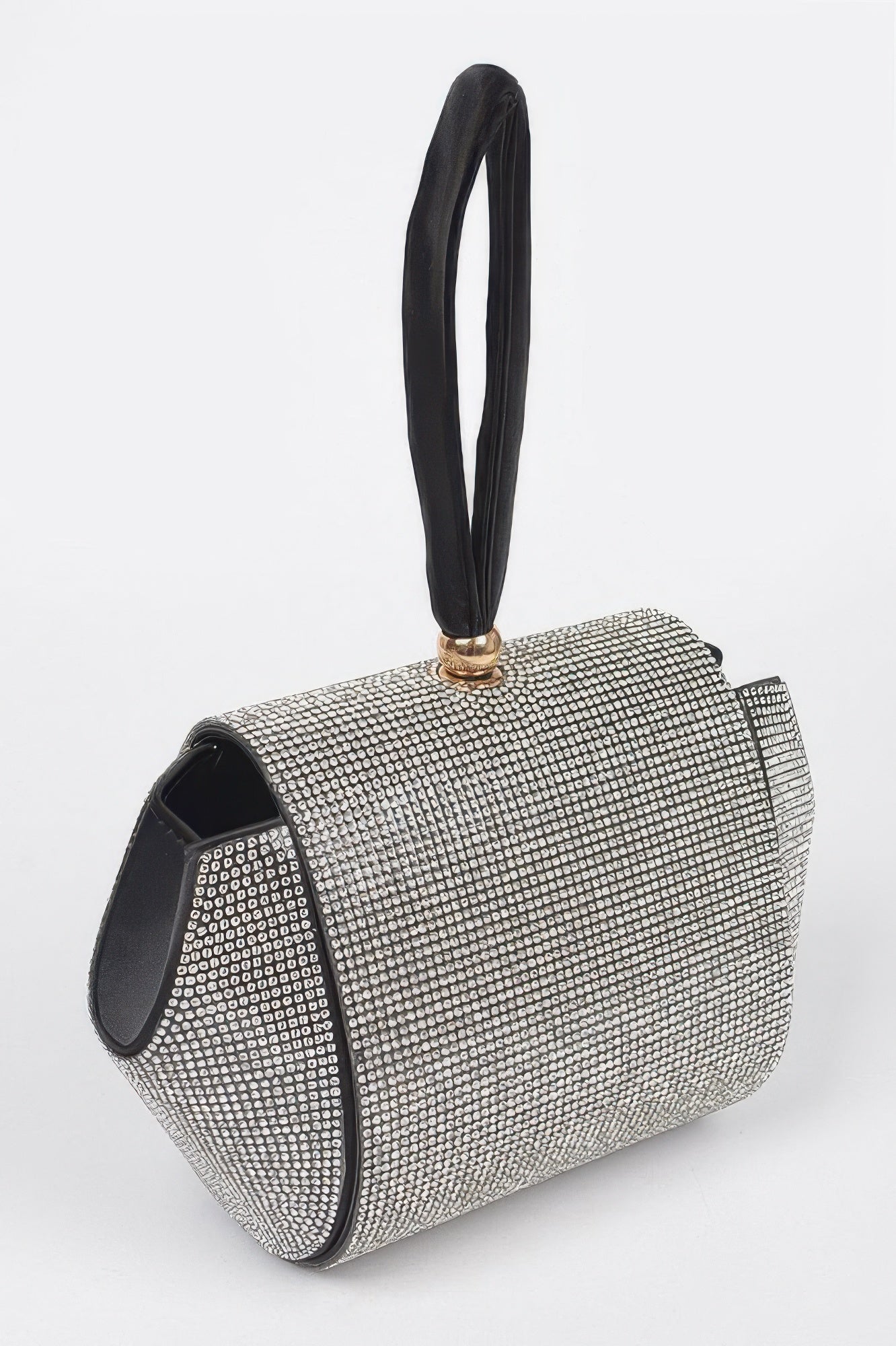 Rhinestone flap clutch side view with black interior trim and top handle loop