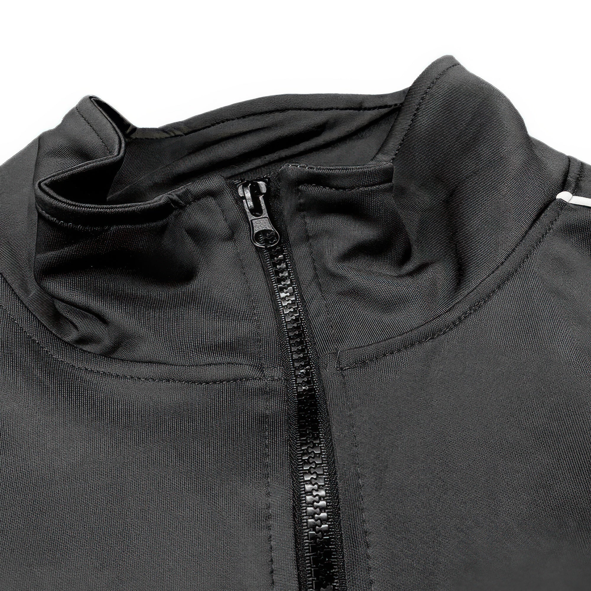 Black track jacket close-up: stand collar and full-length zip with textured pull