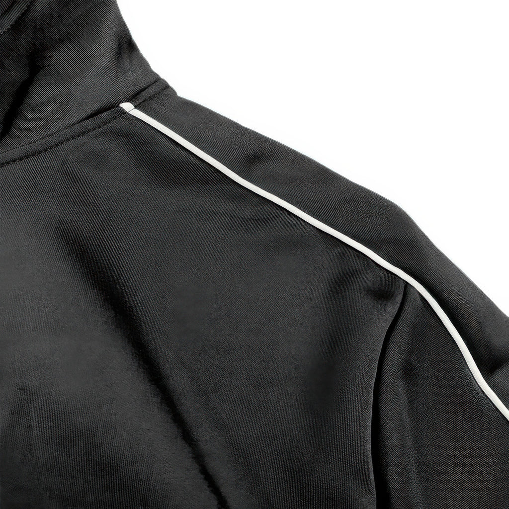 Black track jacket shoulder stripe trim along sleeve seam
