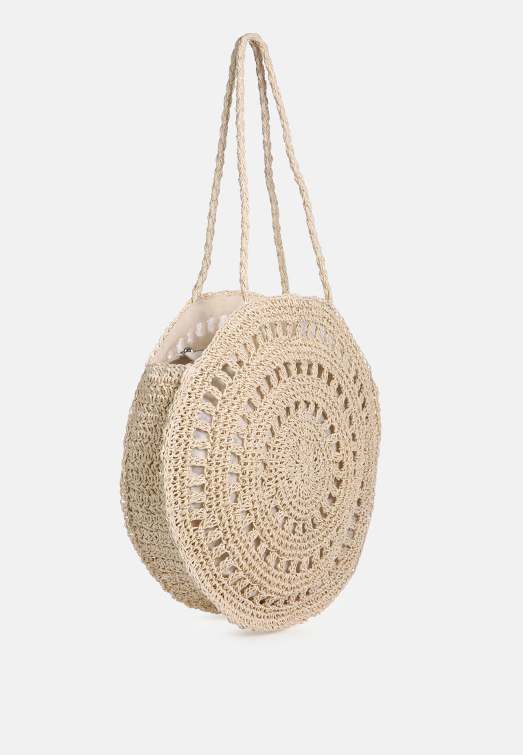 Beige round crochet paper bag, side view with openwork design and two handles