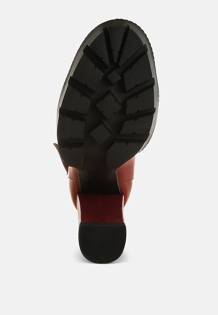 Burgundy boot outsole with rugged tread and thick platform base