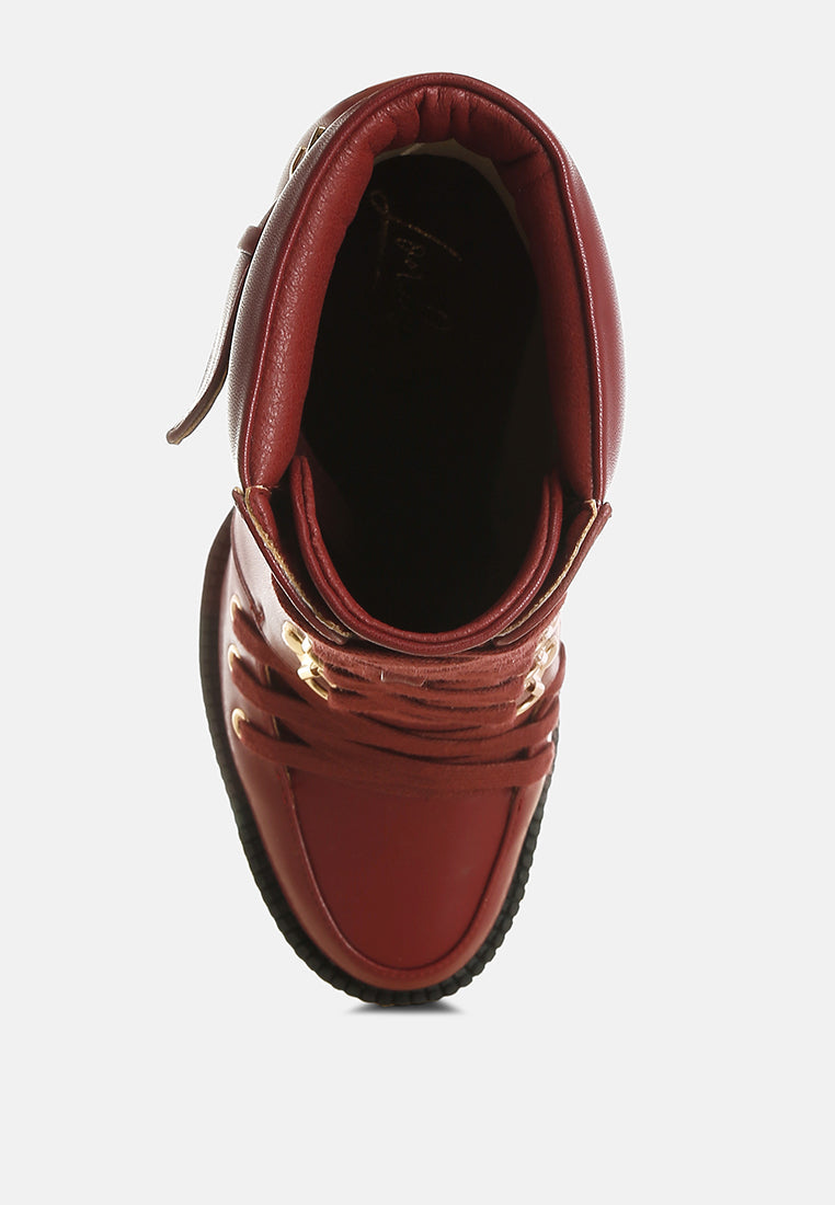 Burgundy combat boot interior view with padded lining and lace-up eyelets