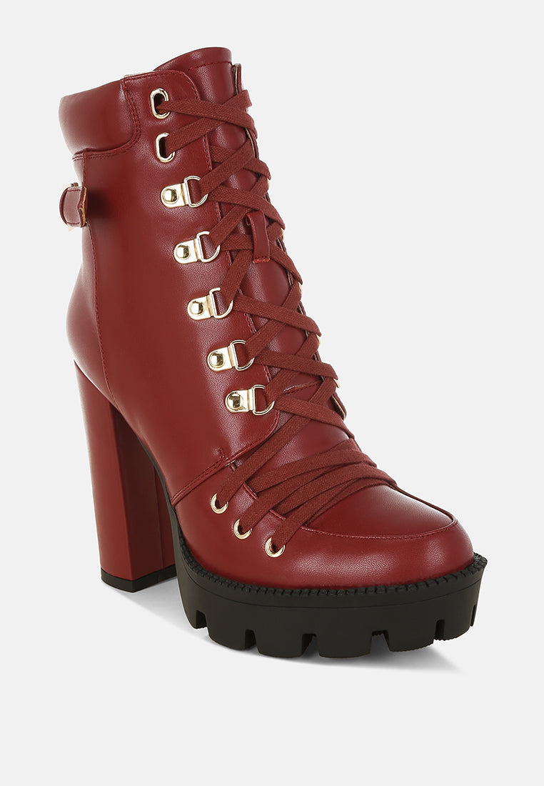 Burgundy lace-up ankle boot with gold eyelets, side straps, and platform sole