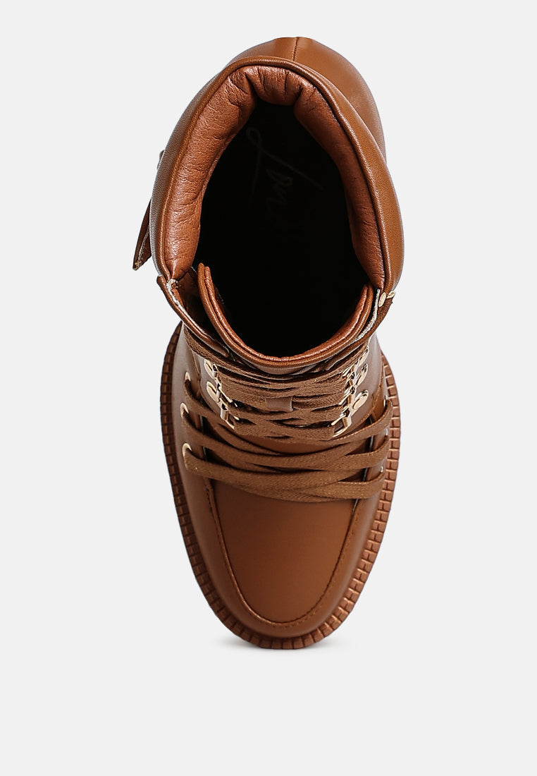 Tan combat boot interior opening with padded collar and lace-up laces