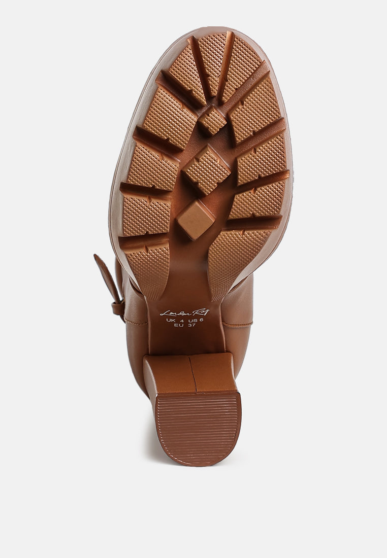 Tan combat boot outsole with tread and platform heel grip