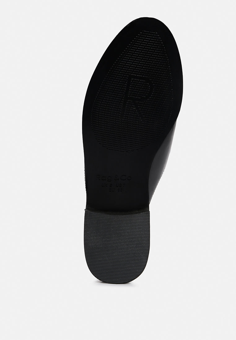 Yashta patent studded flat mule, black outsole and heel base view