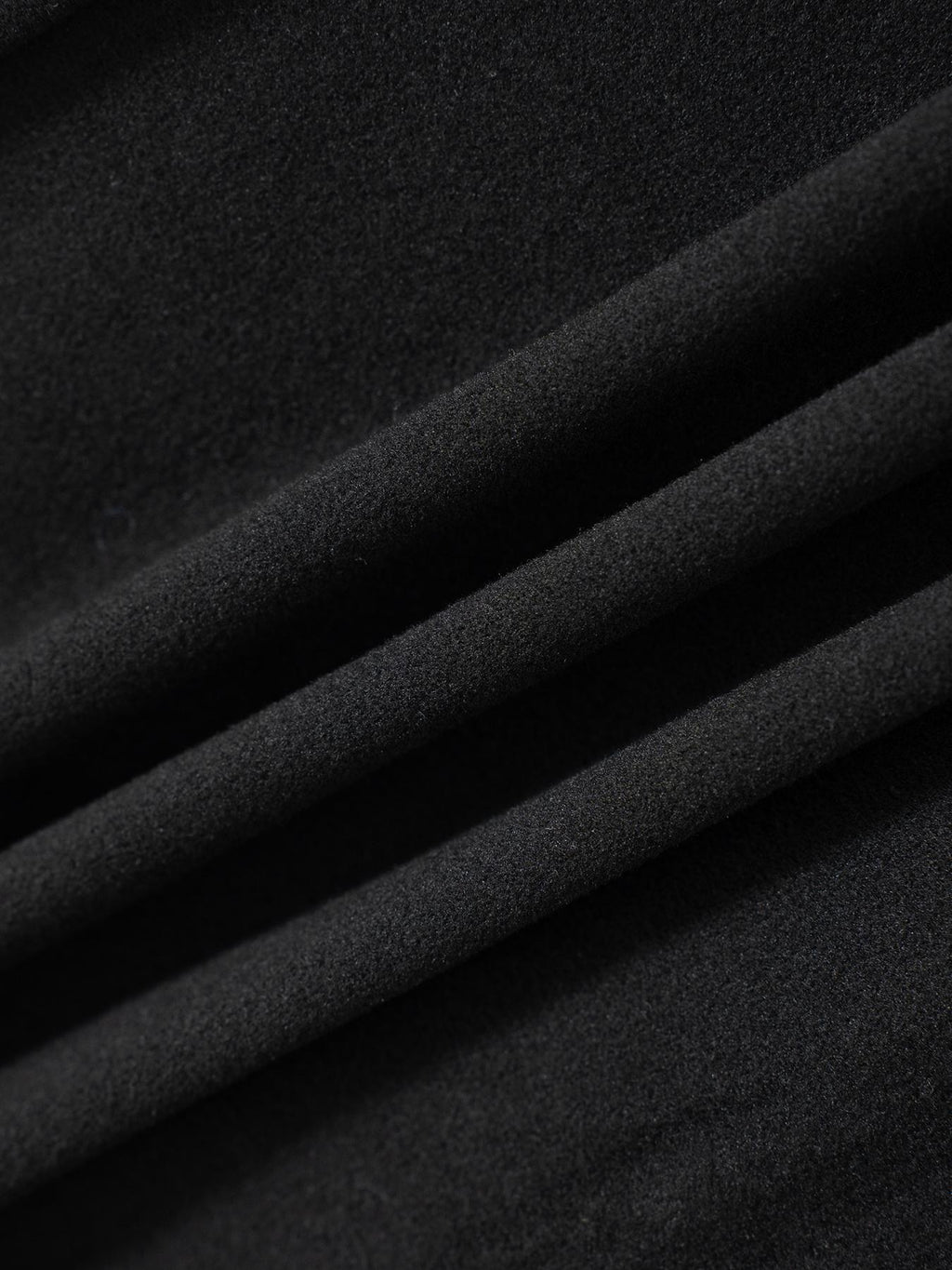 Black drawstring pants fabric texture with soft, matte finish