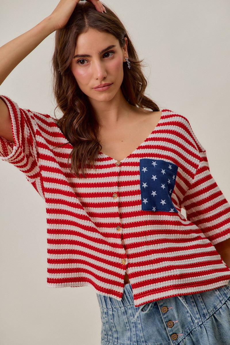 Red-and-ivory striped cardigan with V-neckline, button placket, and blue star pocket