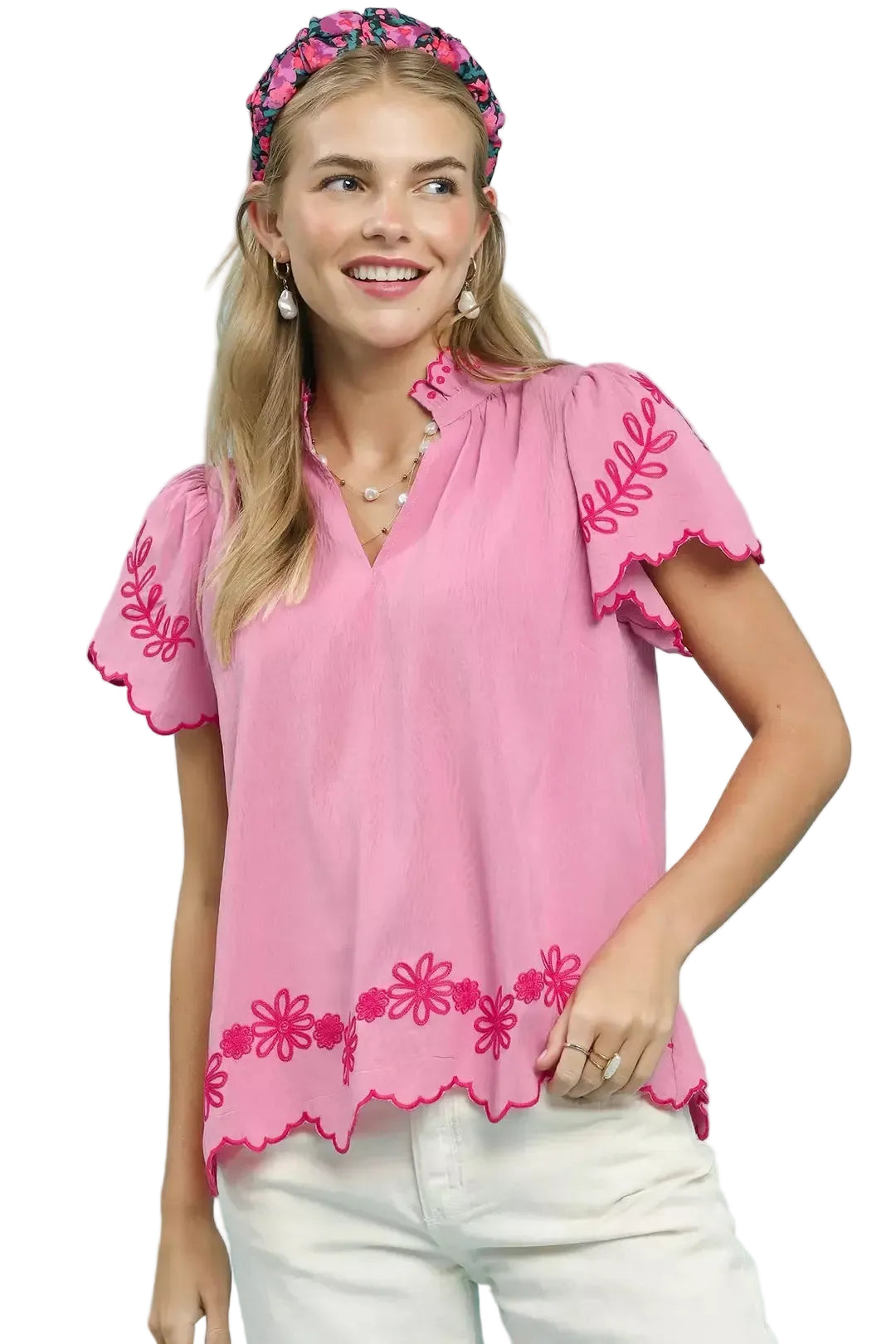 Pink embroidered top with V-neck, scalloped hem, and short flutter sleeves