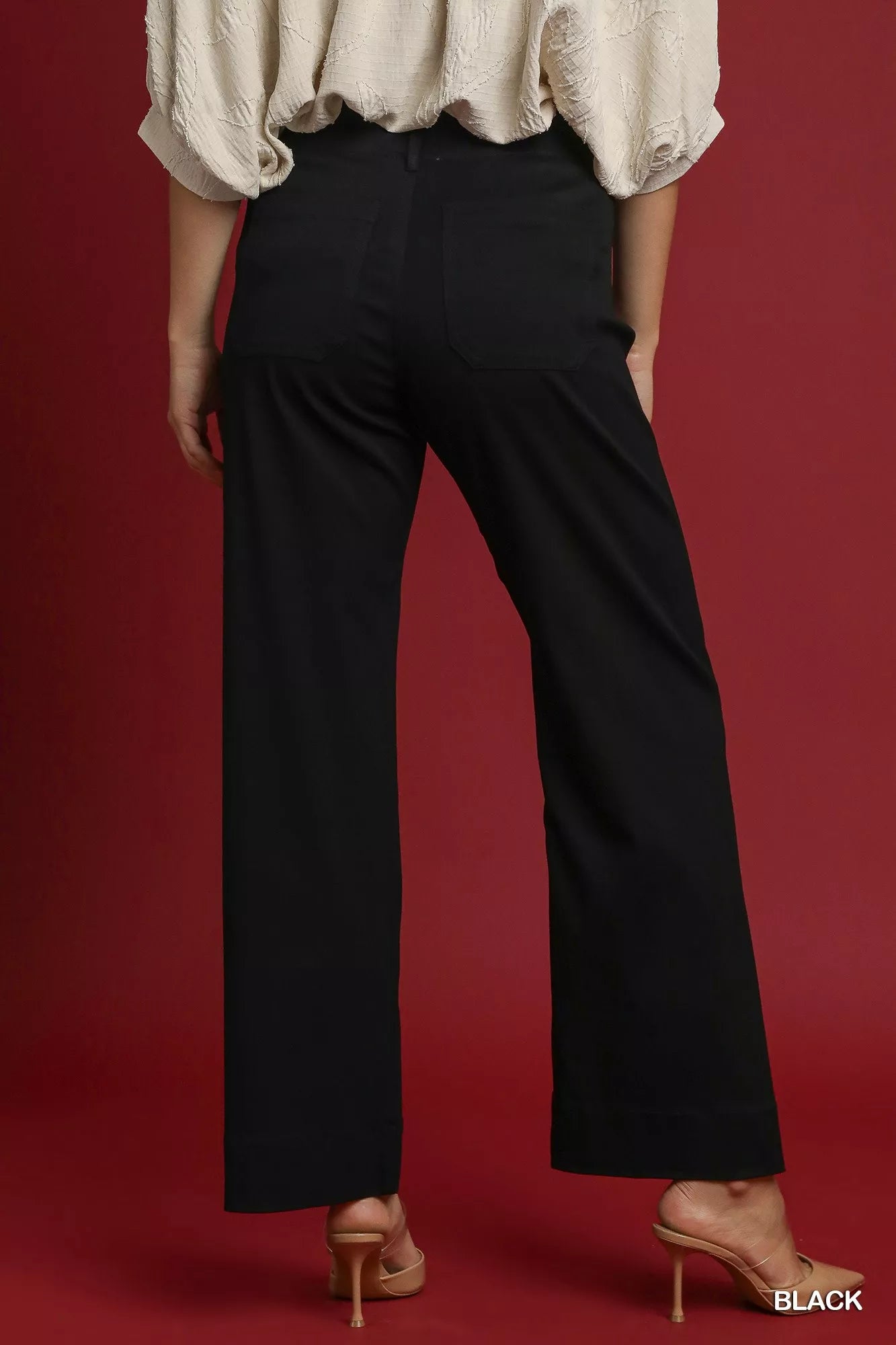 Black button-stretched pants with back yoke seam and relaxed straight fit